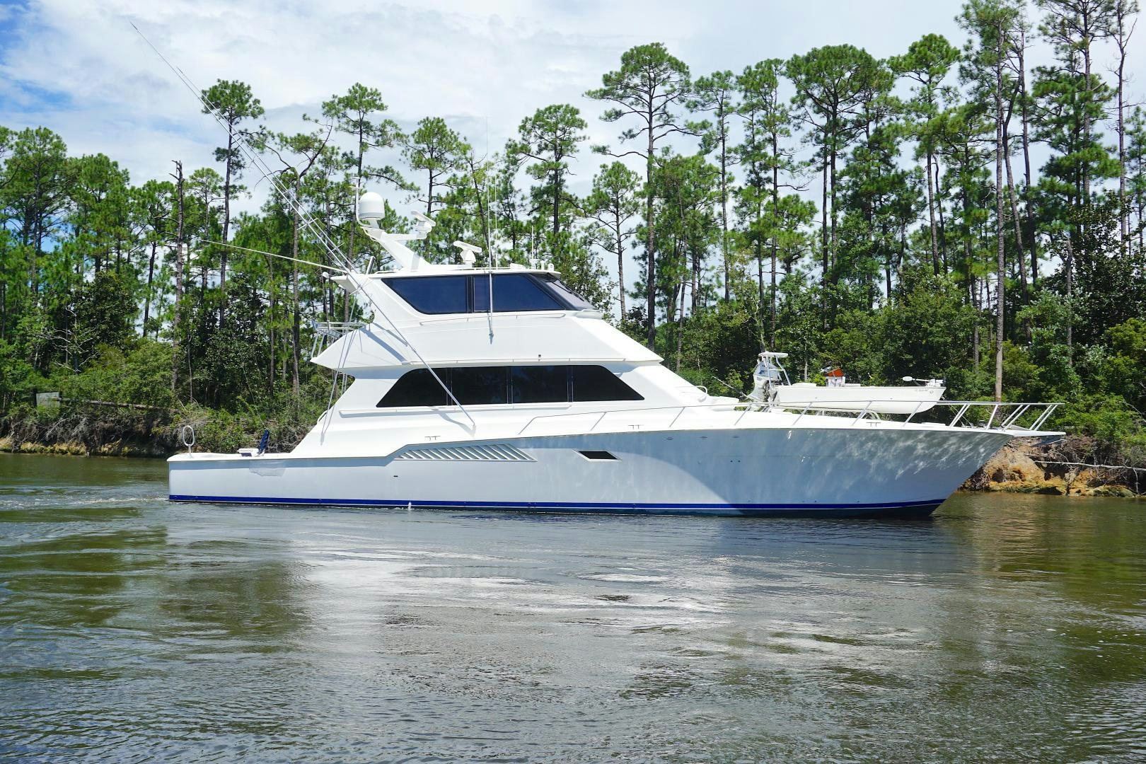a white boat on water aboard CROWN ROYAL Yacht for Sale