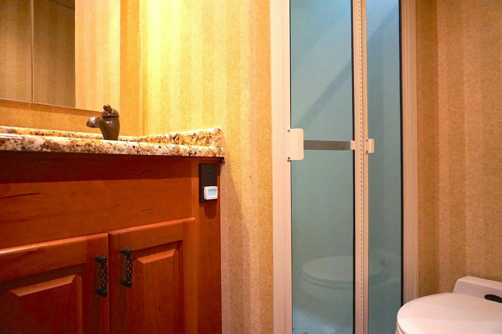 a bathroom with a sink and toilet aboard CROWN ROYAL Yacht for Sale