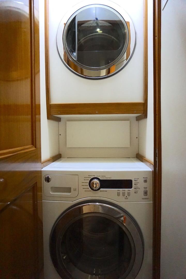 a washer and dryer in a closet aboard CROWN ROYAL Yacht for Sale