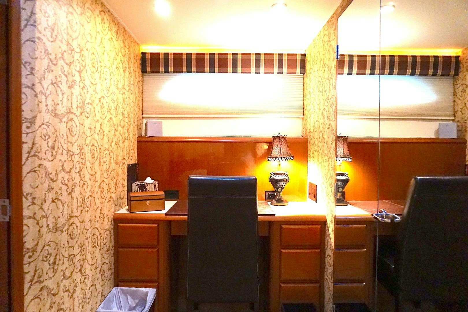 a room with a desk and a chair aboard CROWN ROYAL Yacht for Sale