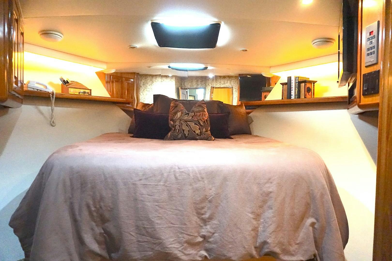 a bed in a room aboard CROWN ROYAL Yacht for Sale