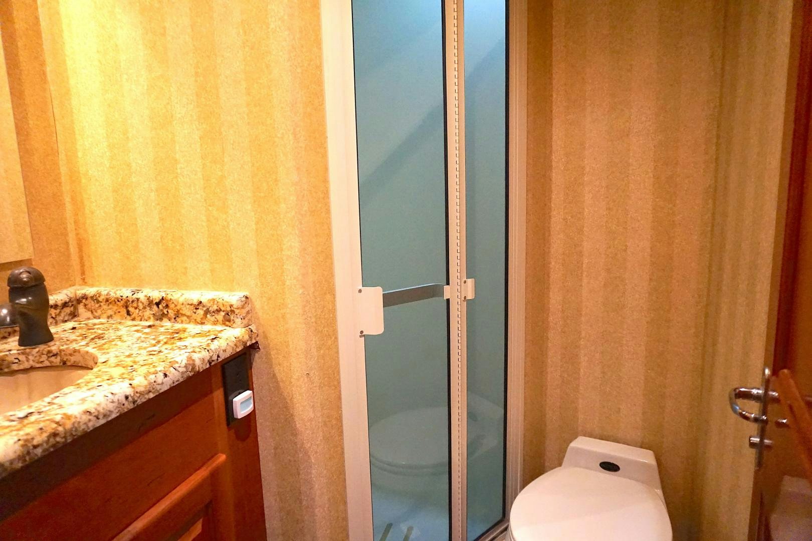 a bathroom with a sink and a toilet aboard CROWN ROYAL Yacht for Sale