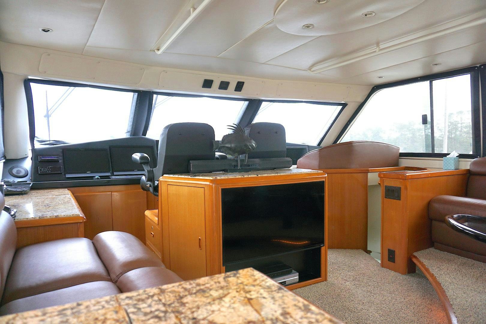 a vehicle with a tv and a couch aboard CROWN ROYAL Yacht for Sale