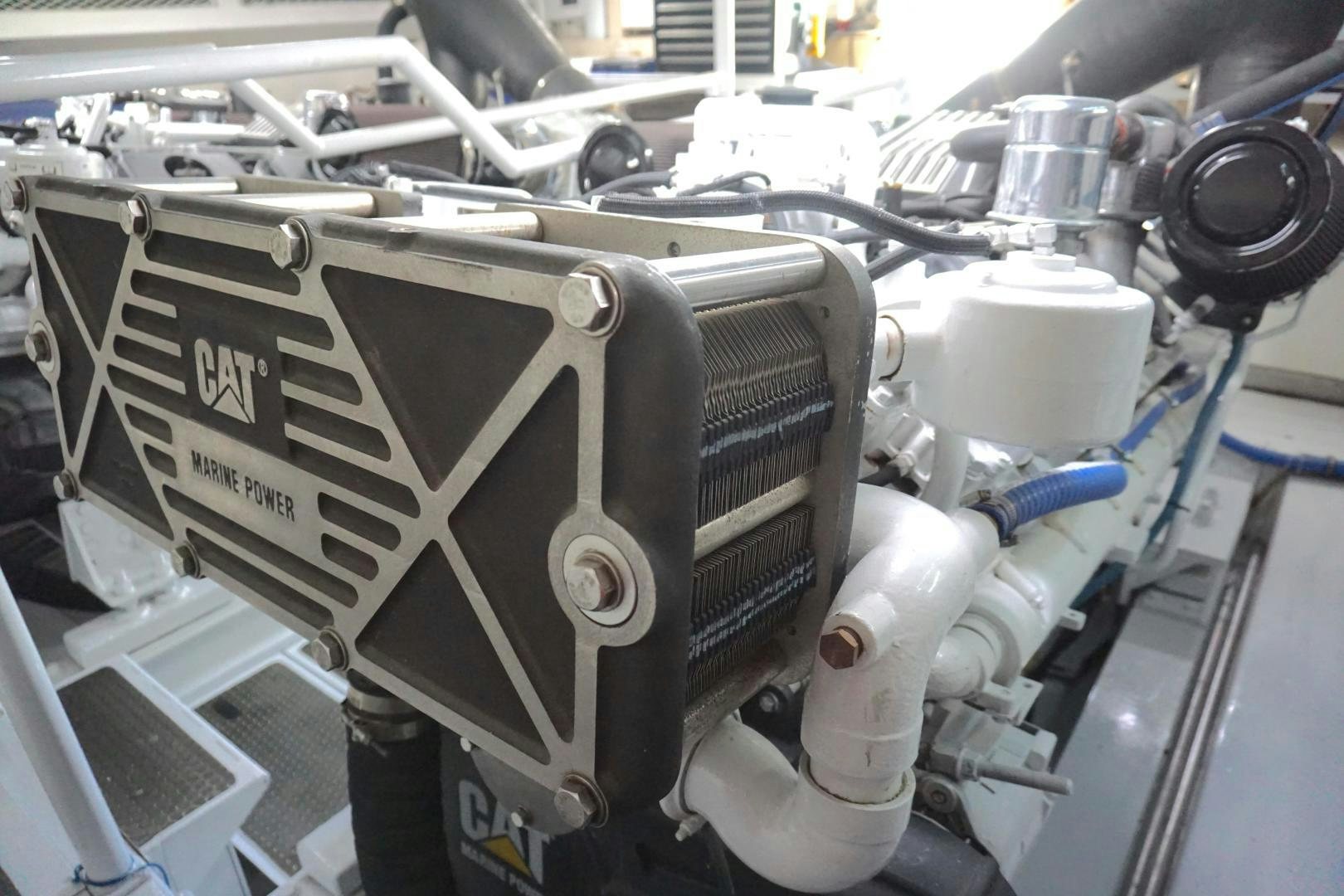 a car engine with a blue handle aboard CROWN ROYAL Yacht for Sale
