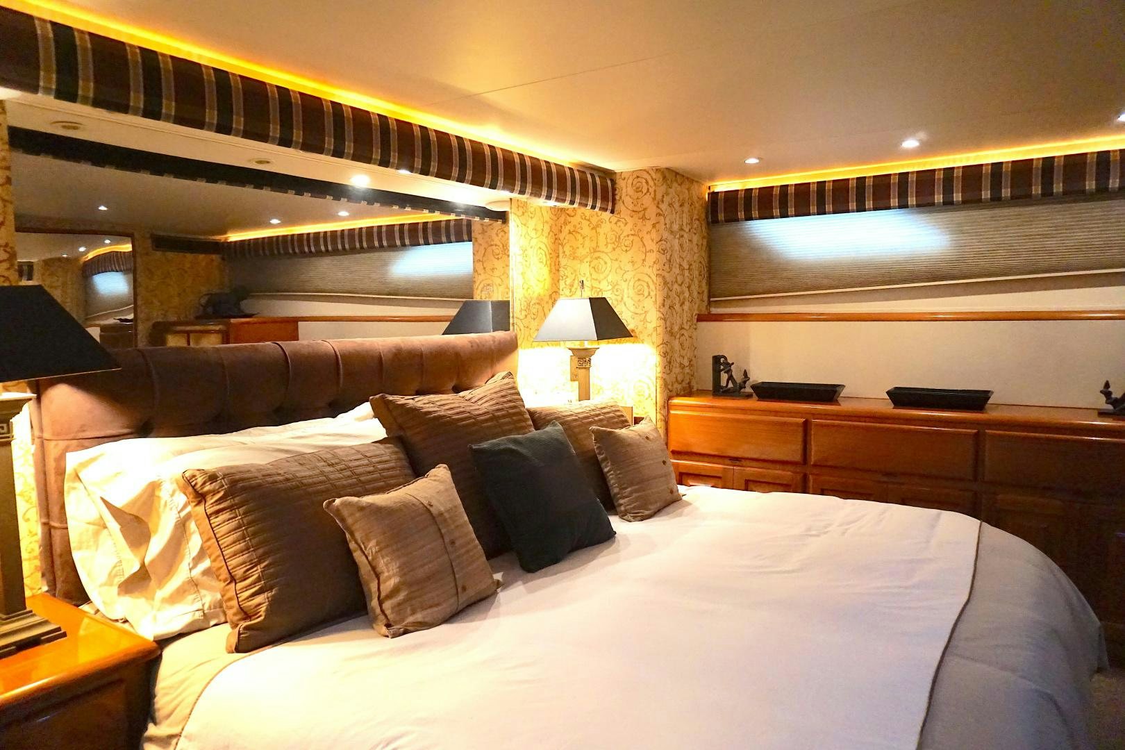 a bed with pillows aboard CROWN ROYAL Yacht for Sale