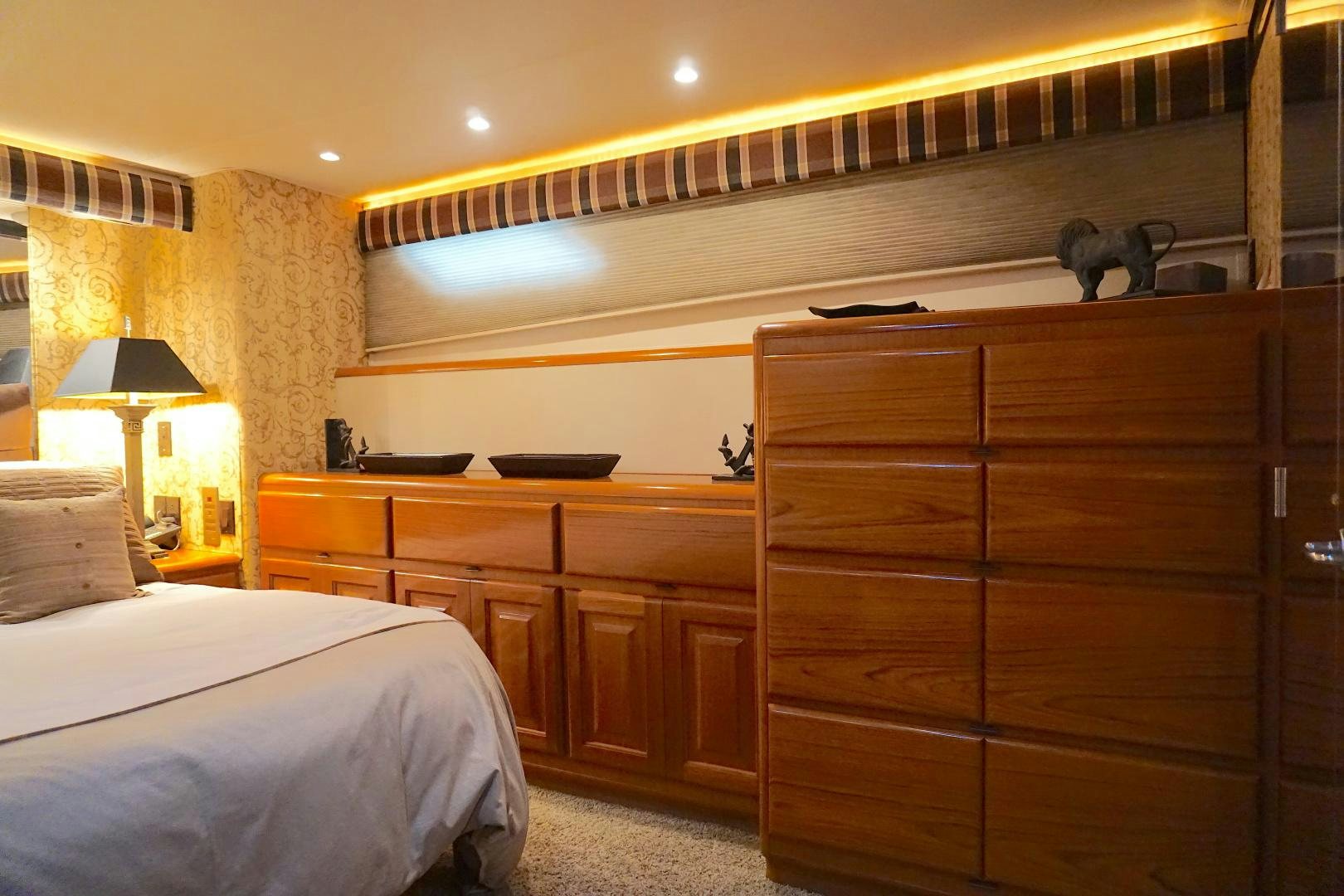 a bedroom with a couple of beds aboard CROWN ROYAL Yacht for Sale