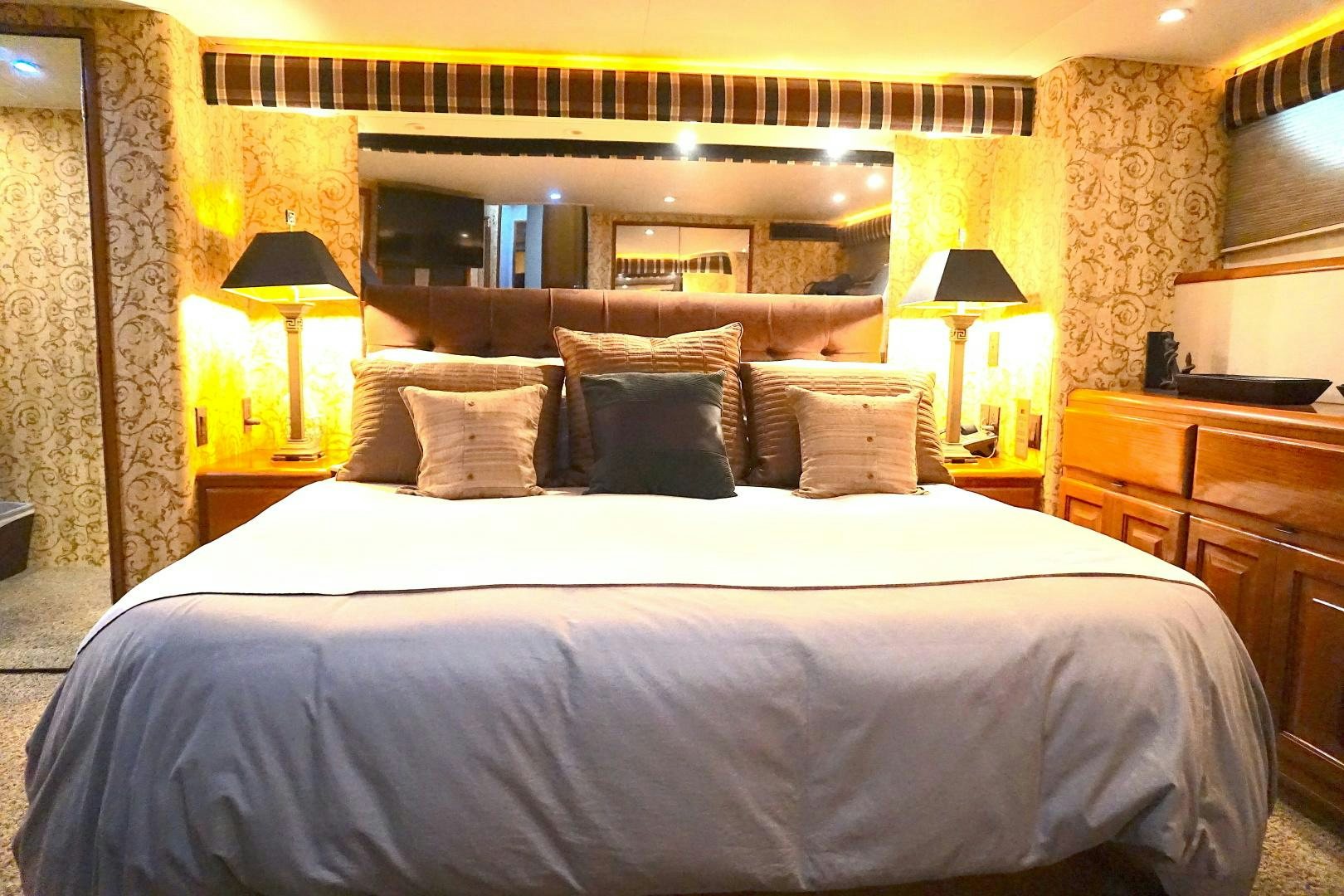 a bed with pillows aboard CROWN ROYAL Yacht for Sale