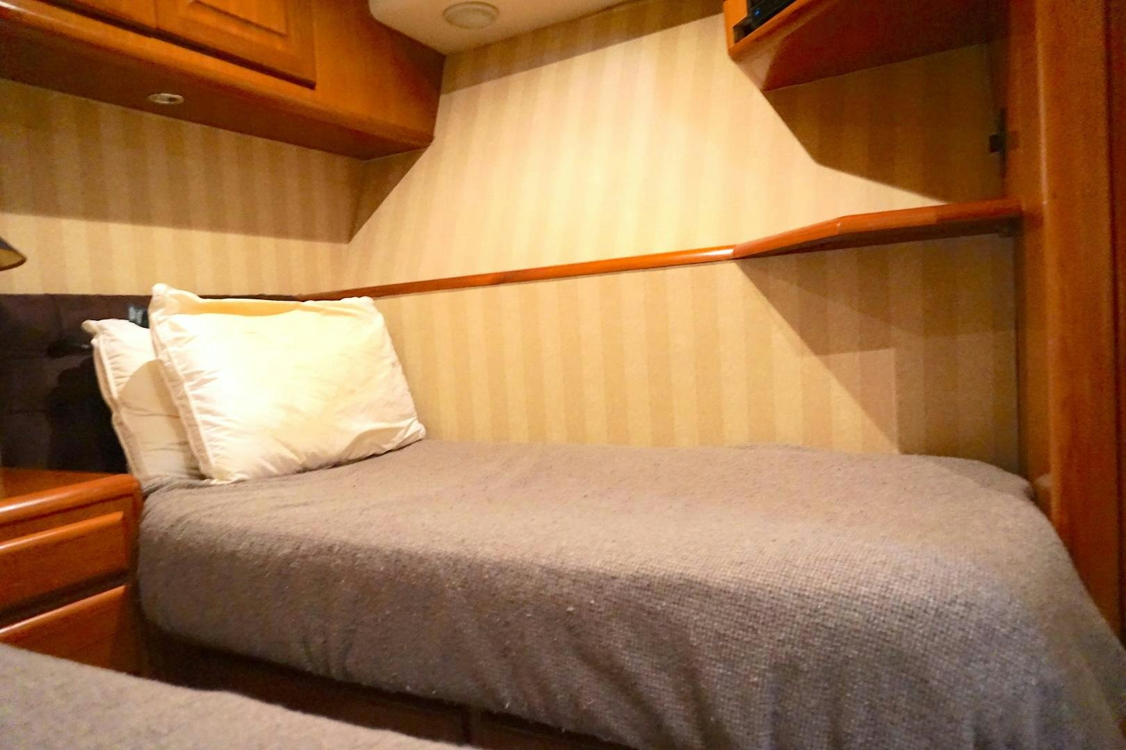 a bed with a canopy aboard CROWN ROYAL Yacht for Sale
