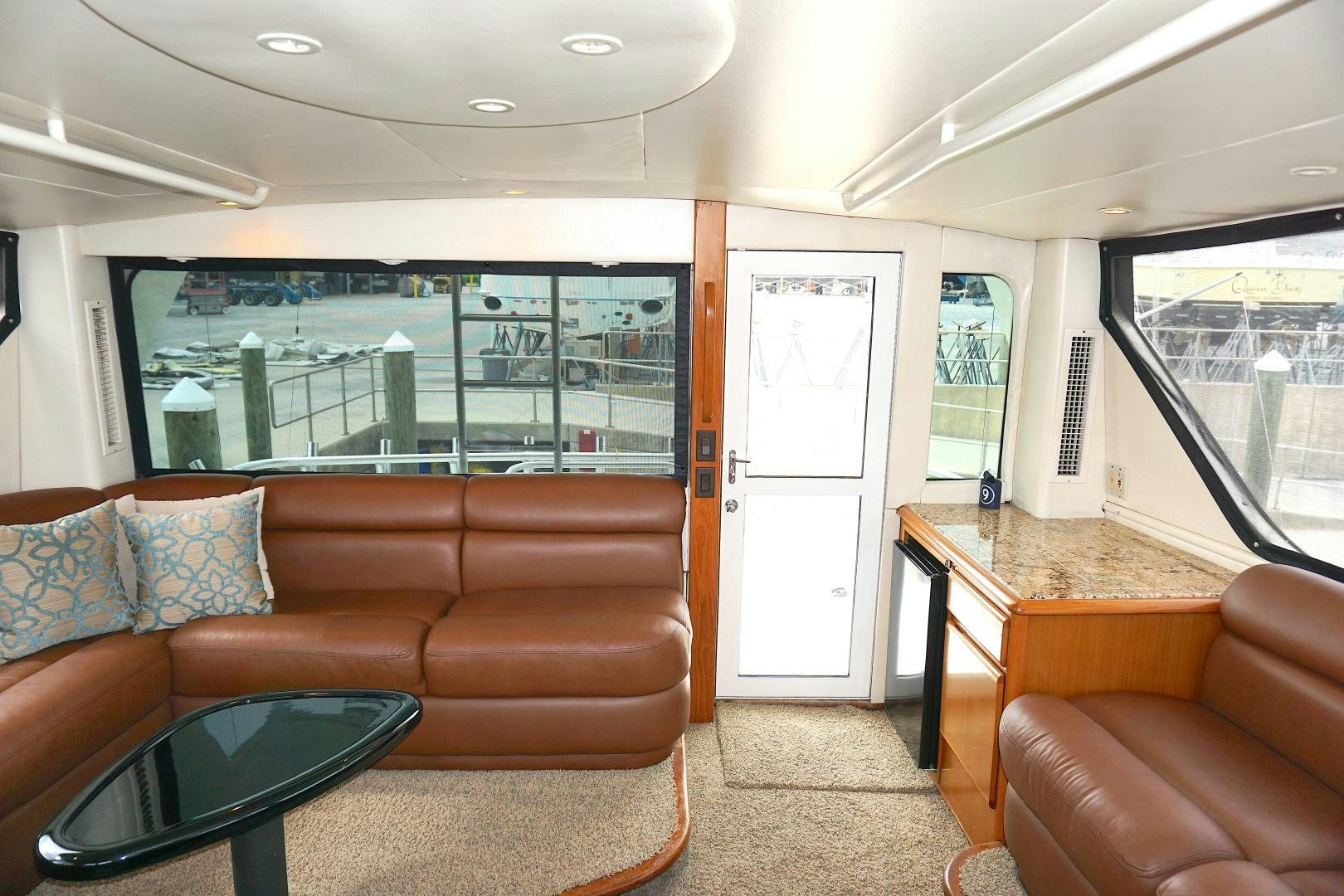 a living room with a large window aboard CROWN ROYAL Yacht for Sale