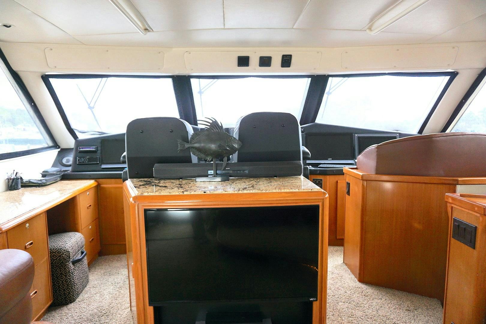 a room with a desk and a computer aboard CROWN ROYAL Yacht for Sale