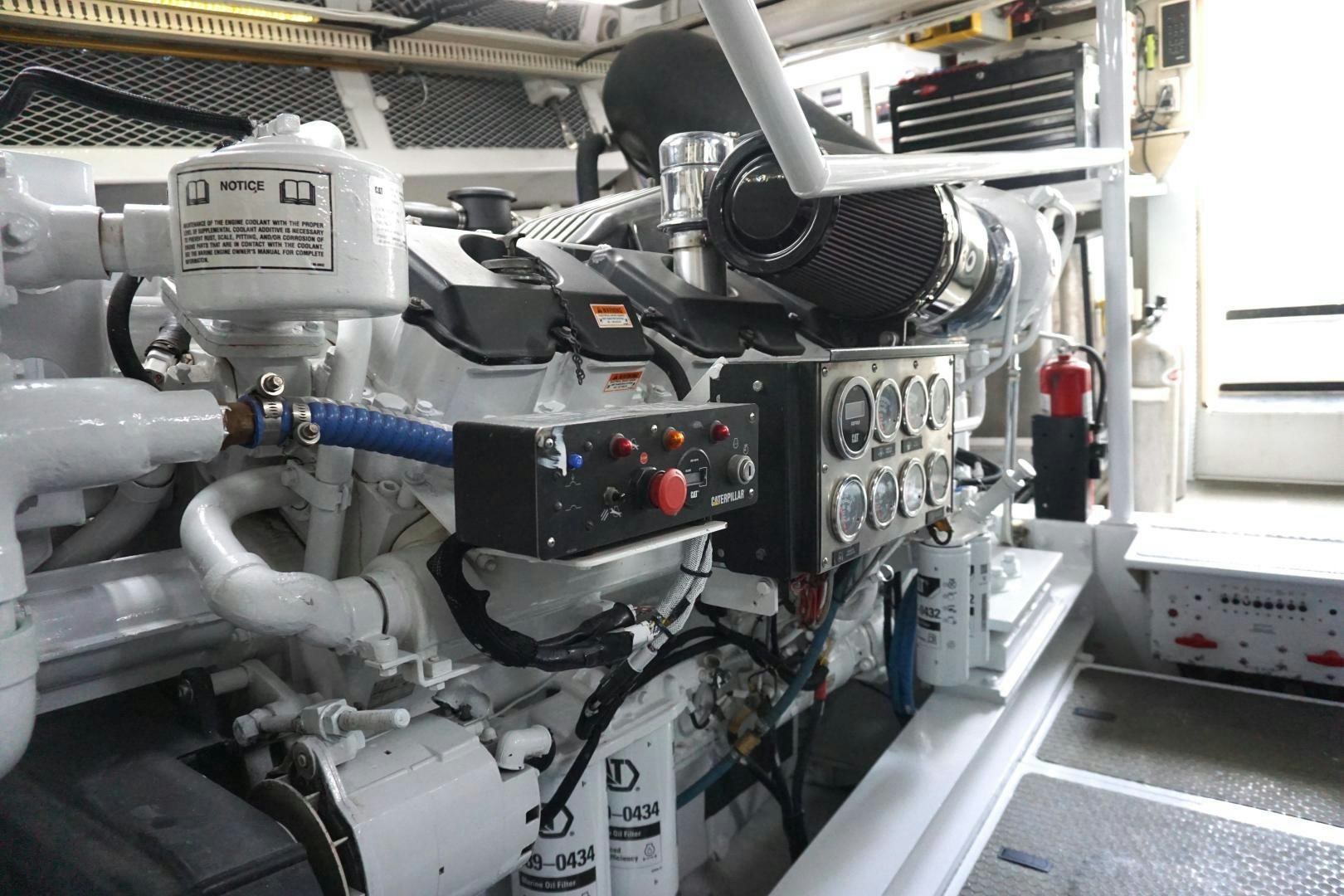 a car engine with a blue handle aboard CROWN ROYAL Yacht for Sale
