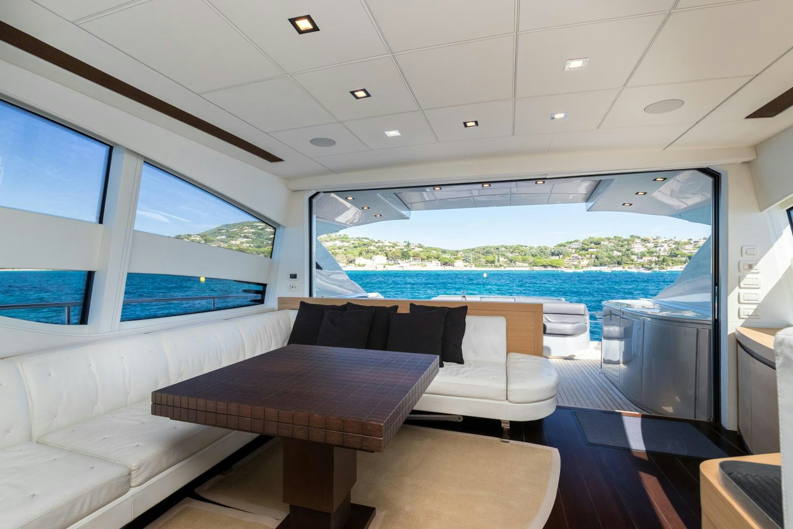 a room with a table and chairs aboard LOONEY Yacht for Sale