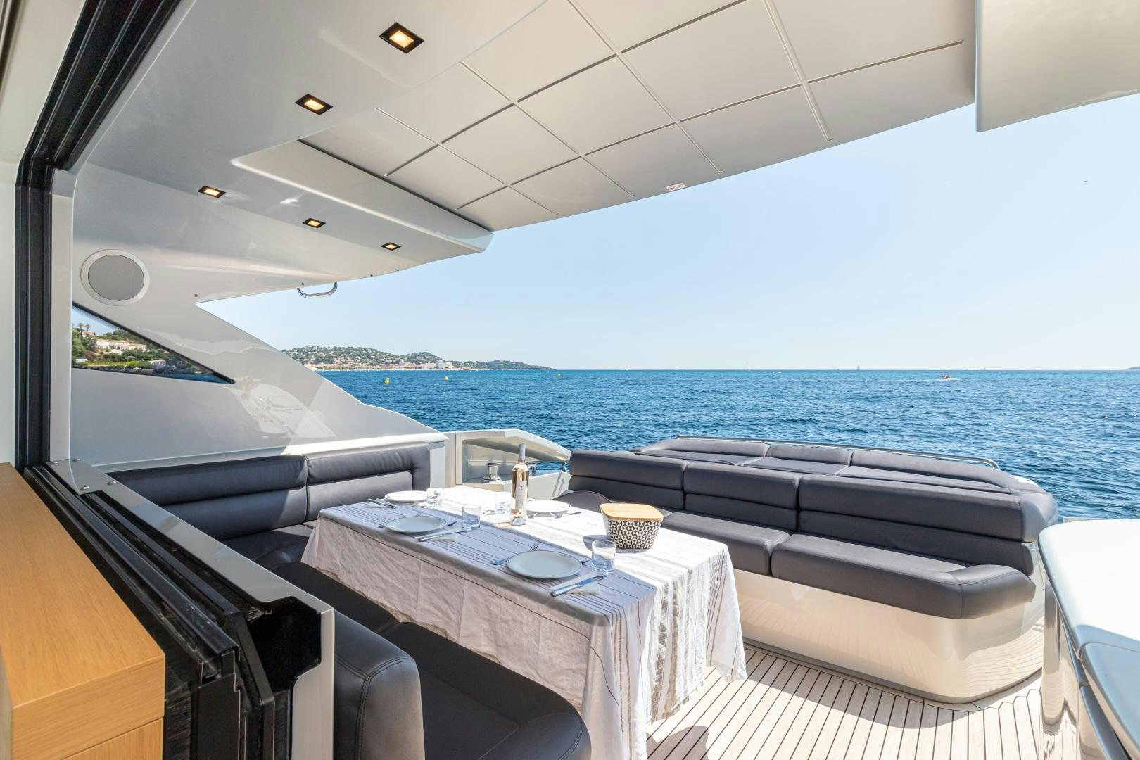 a room with a table and chairs aboard LOONEY Yacht for Sale