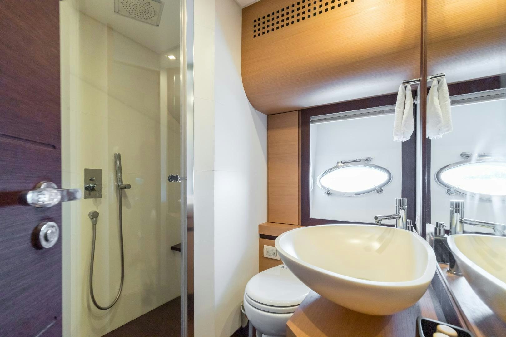 a bathroom with a sink and toilet aboard LOONEY Yacht for Sale