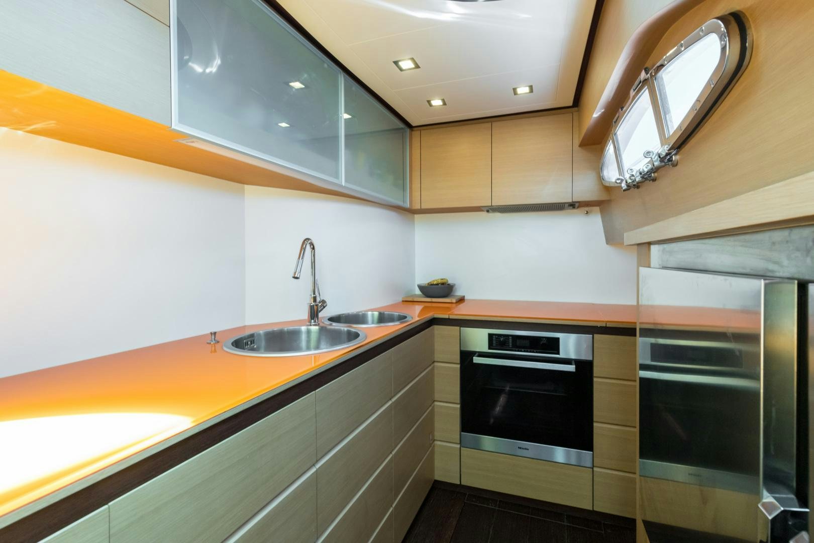 a kitchen with a sink and cabinets aboard LOONEY Yacht for Sale
