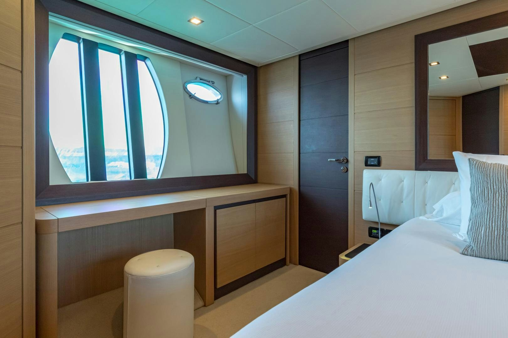 a room with a bed and a window aboard LOONEY Yacht for Sale