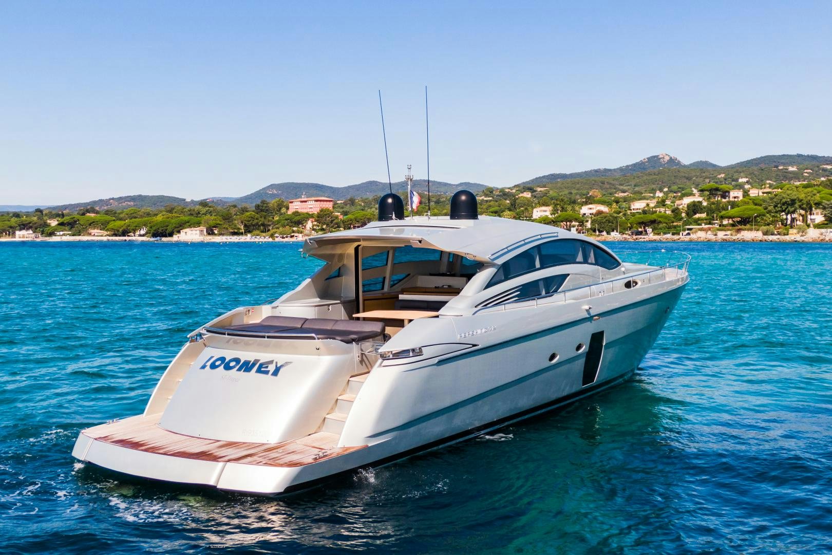 a white boat in the water aboard LOONEY Yacht for Sale
