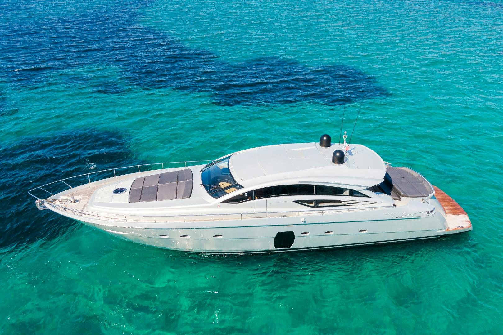 a white boat in the water aboard LOONEY Yacht for Sale