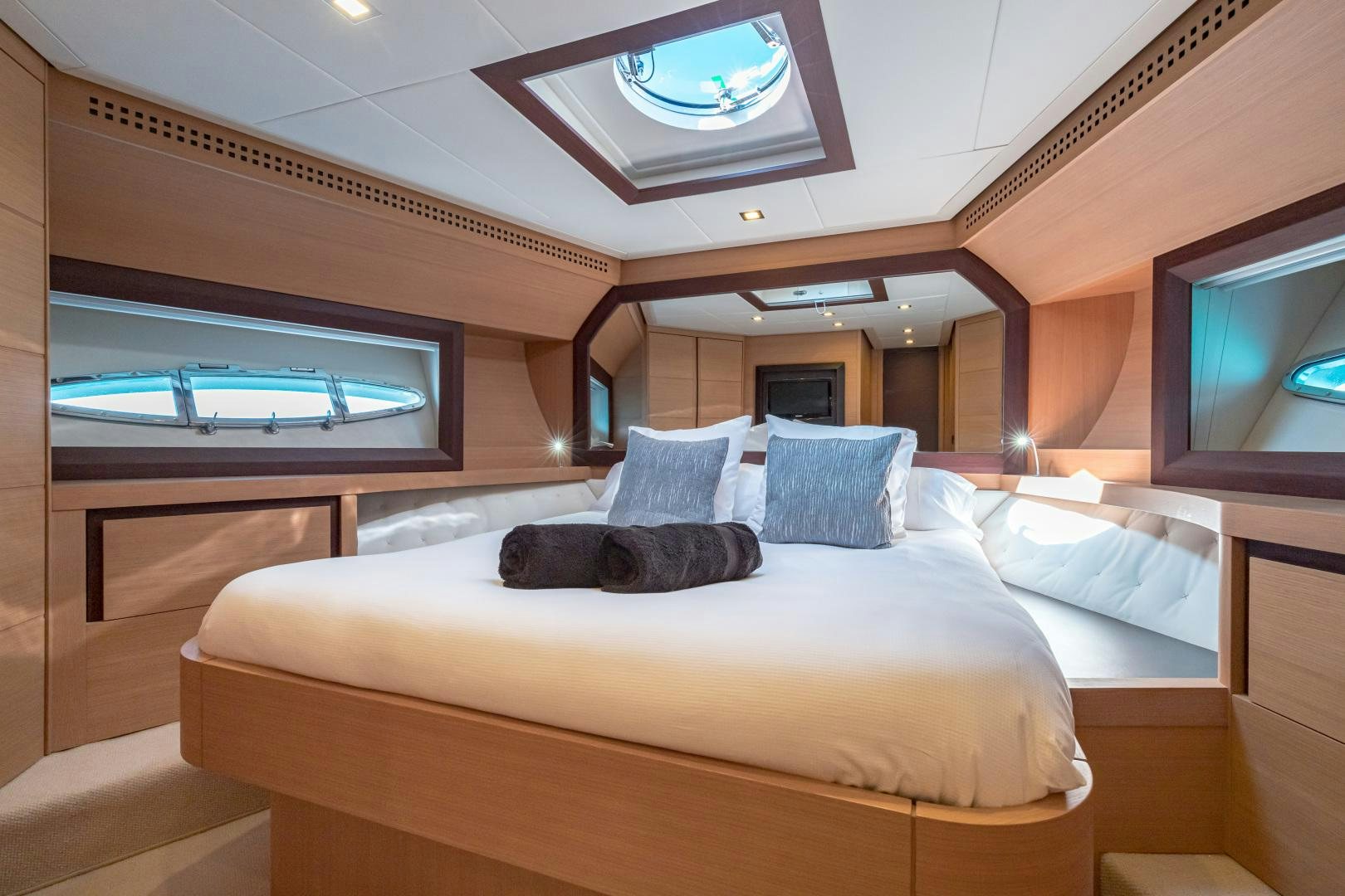 a large bed in a room aboard LOONEY Yacht for Sale