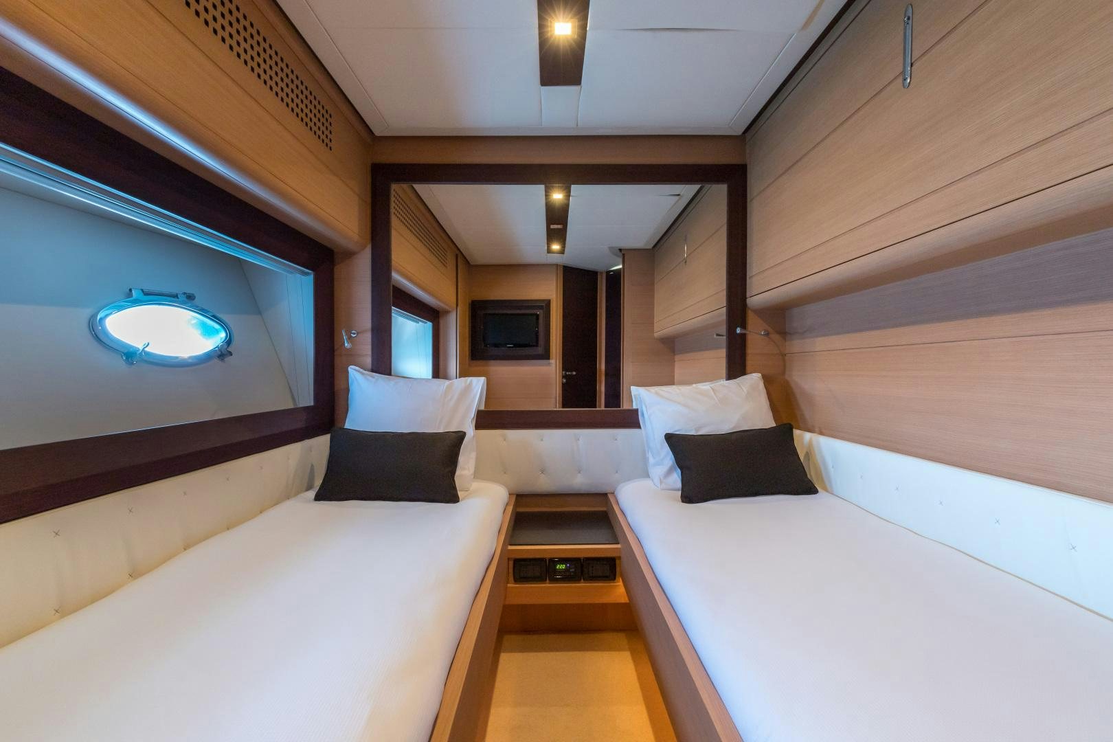 a room with a bed and a television aboard LOONEY Yacht for Sale