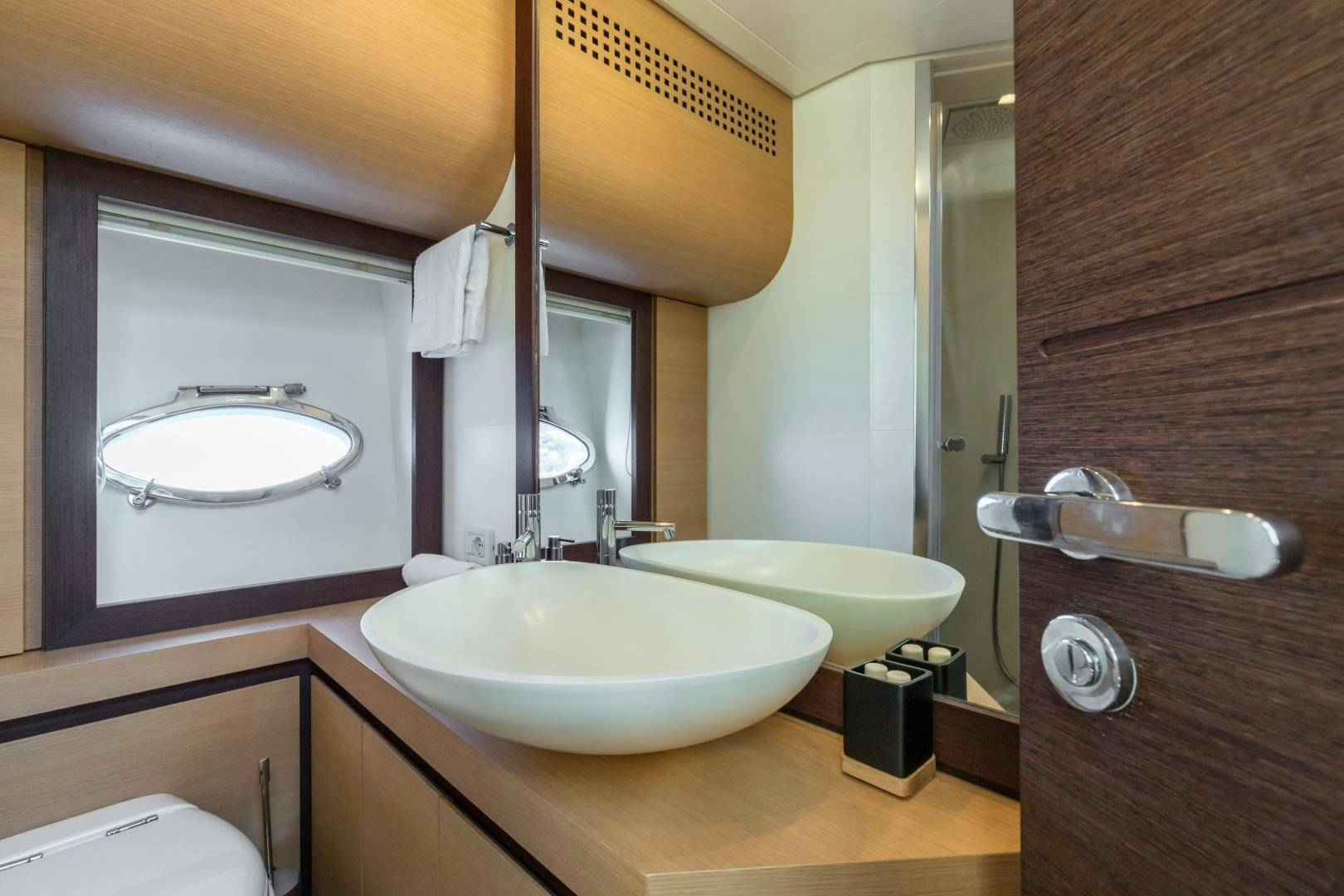 a bathroom with a large mirror aboard LOONEY Yacht for Sale