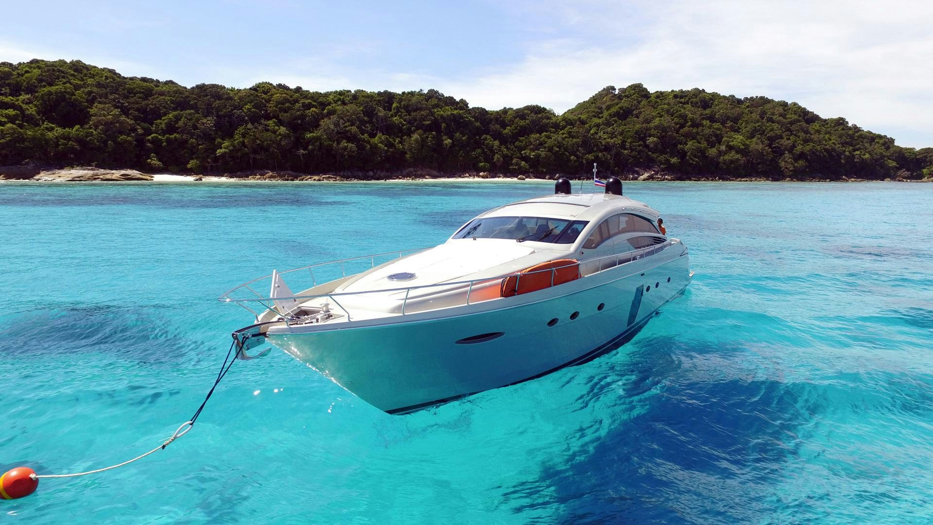 a white boat in the water aboard TOYZ4BOYZ Yacht for Sale