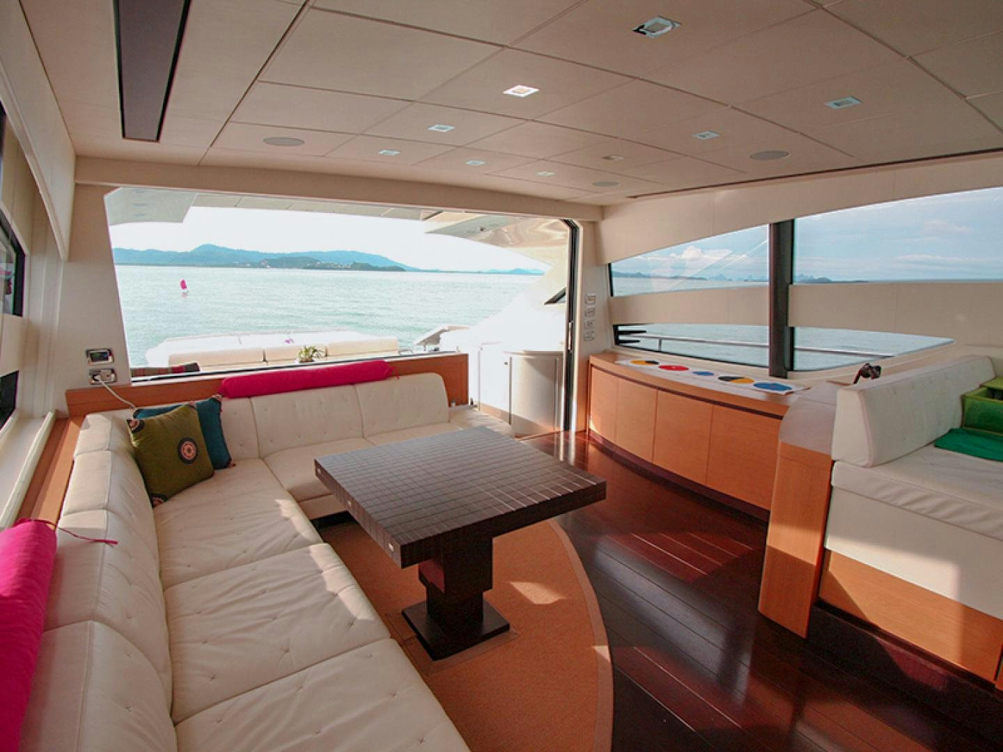 a room with a bed and a table aboard TOYZ4BOYZ Yacht for Sale
