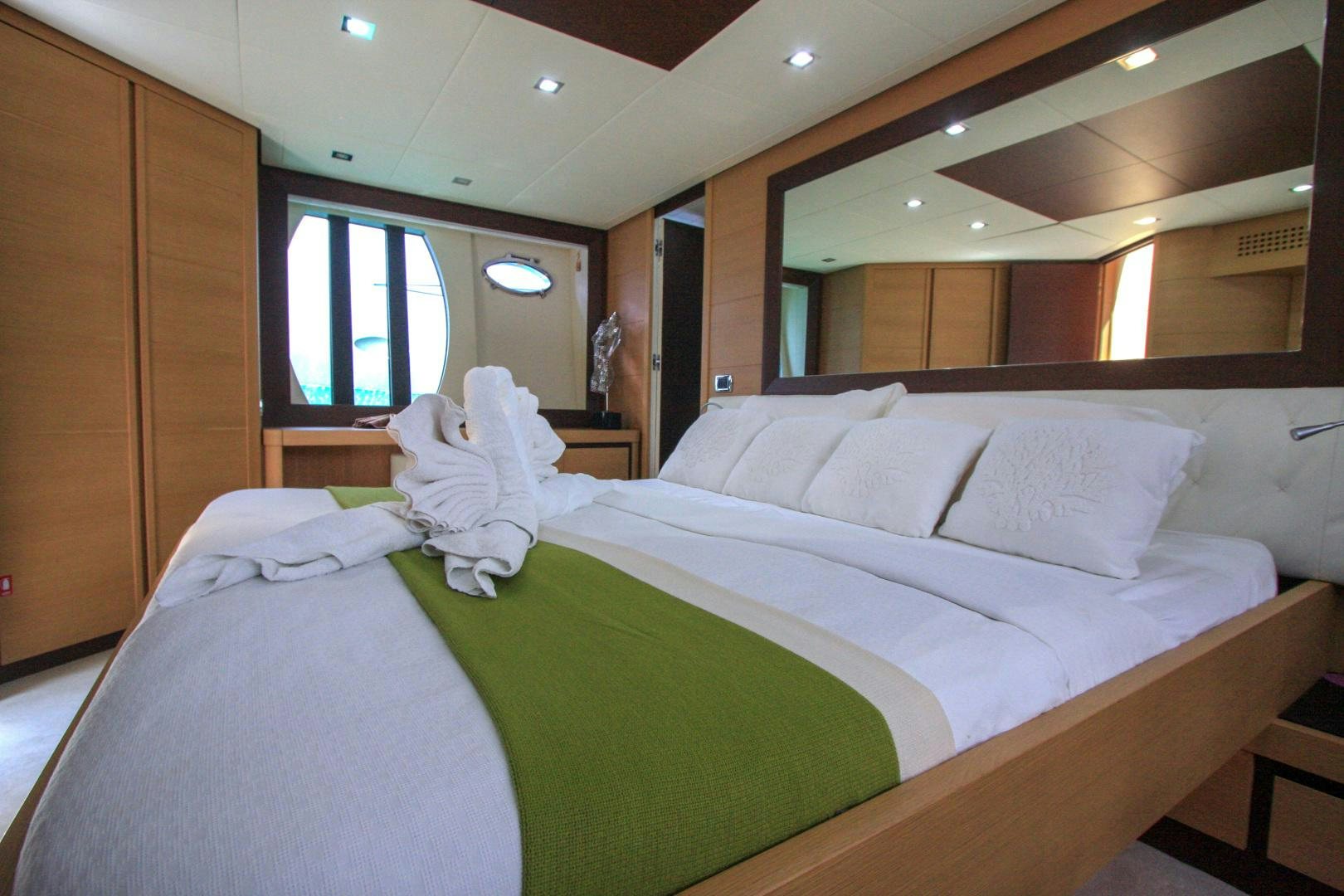 a room with a bed and a window aboard TOYZ4BOYZ Yacht for Sale