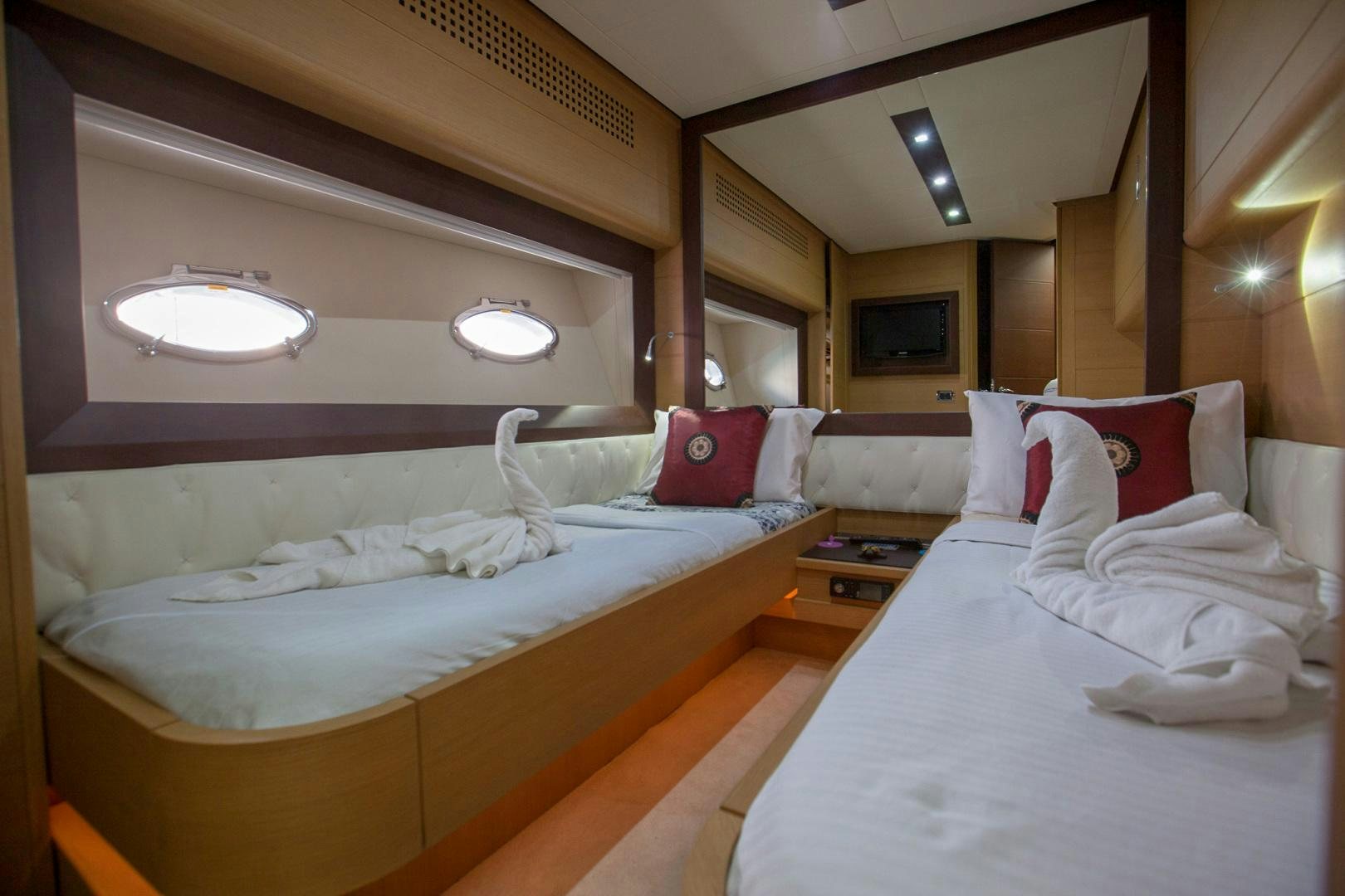 a room with two beds aboard TOYZ4BOYZ Yacht for Sale