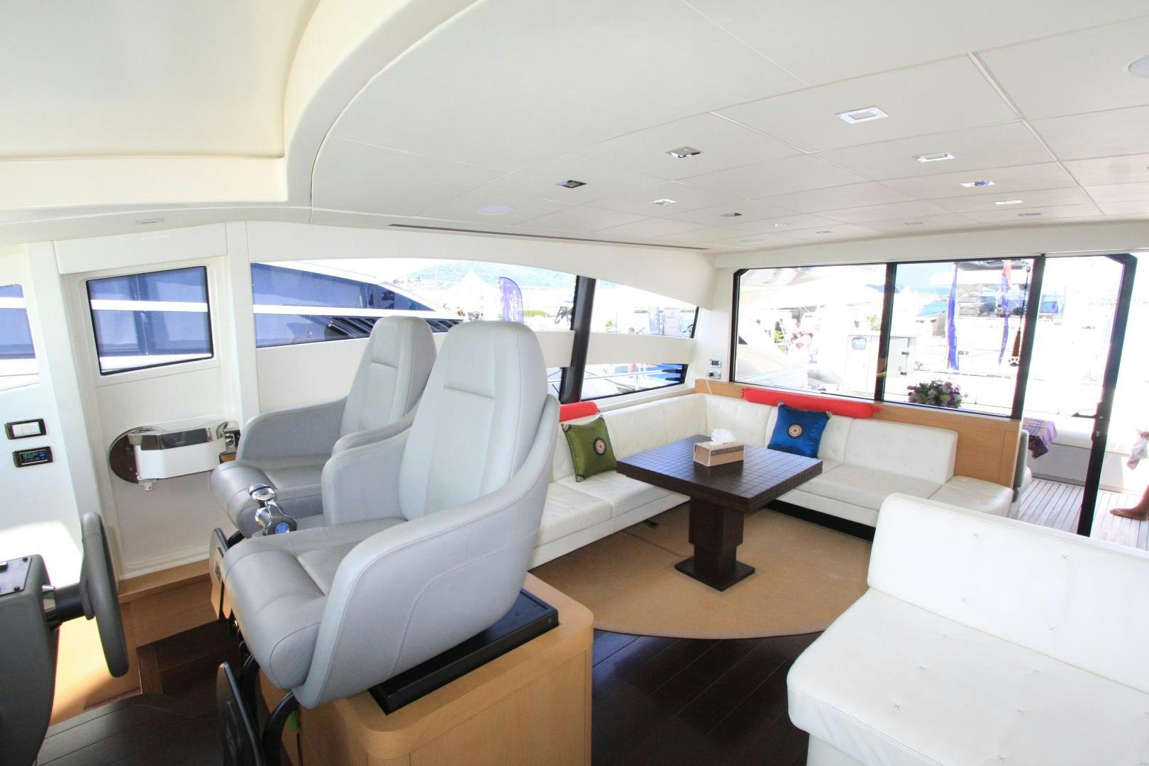 inside of a vehicle with a table and chairs and a window aboard TOYZ4BOYZ Yacht for Sale