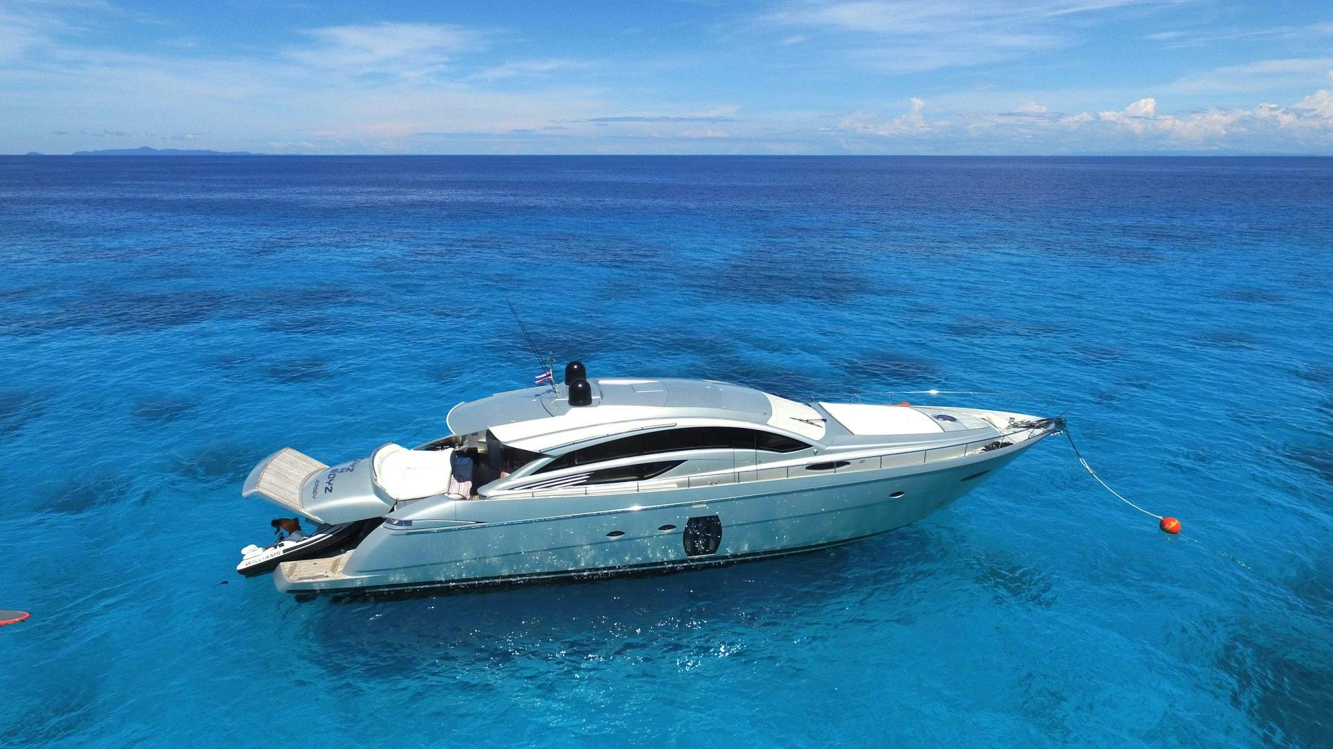 a white boat in the water aboard TOYZ4BOYZ Yacht for Sale