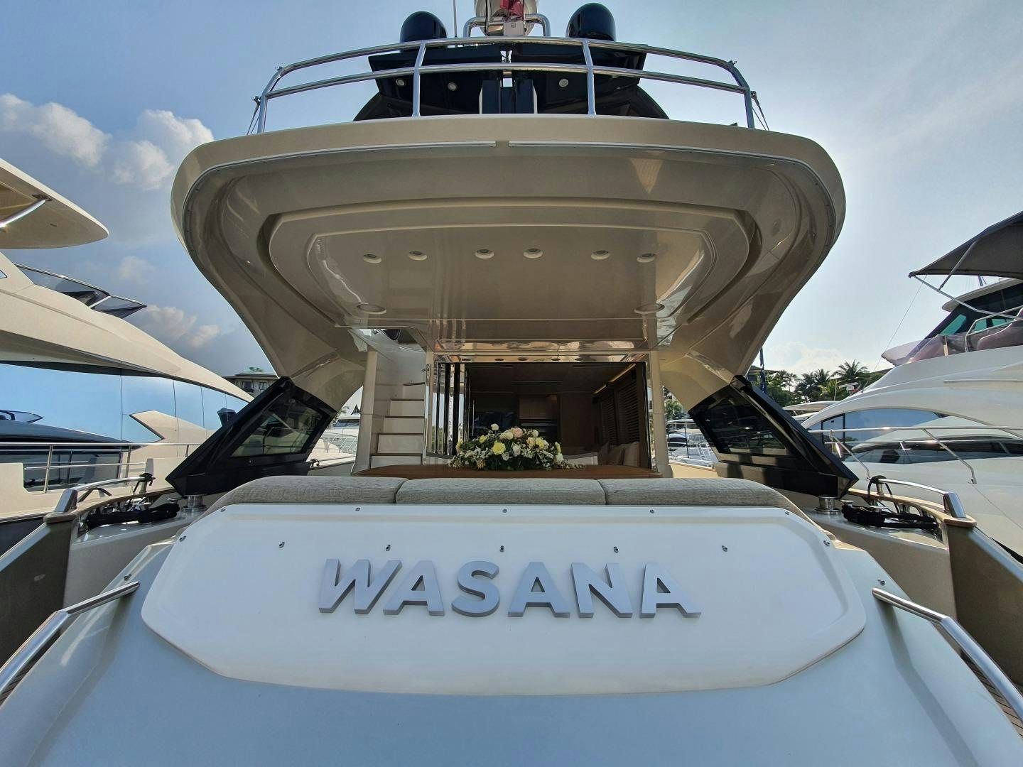 a white boat with a sign on the front aboard WASANA Yacht for Sale
