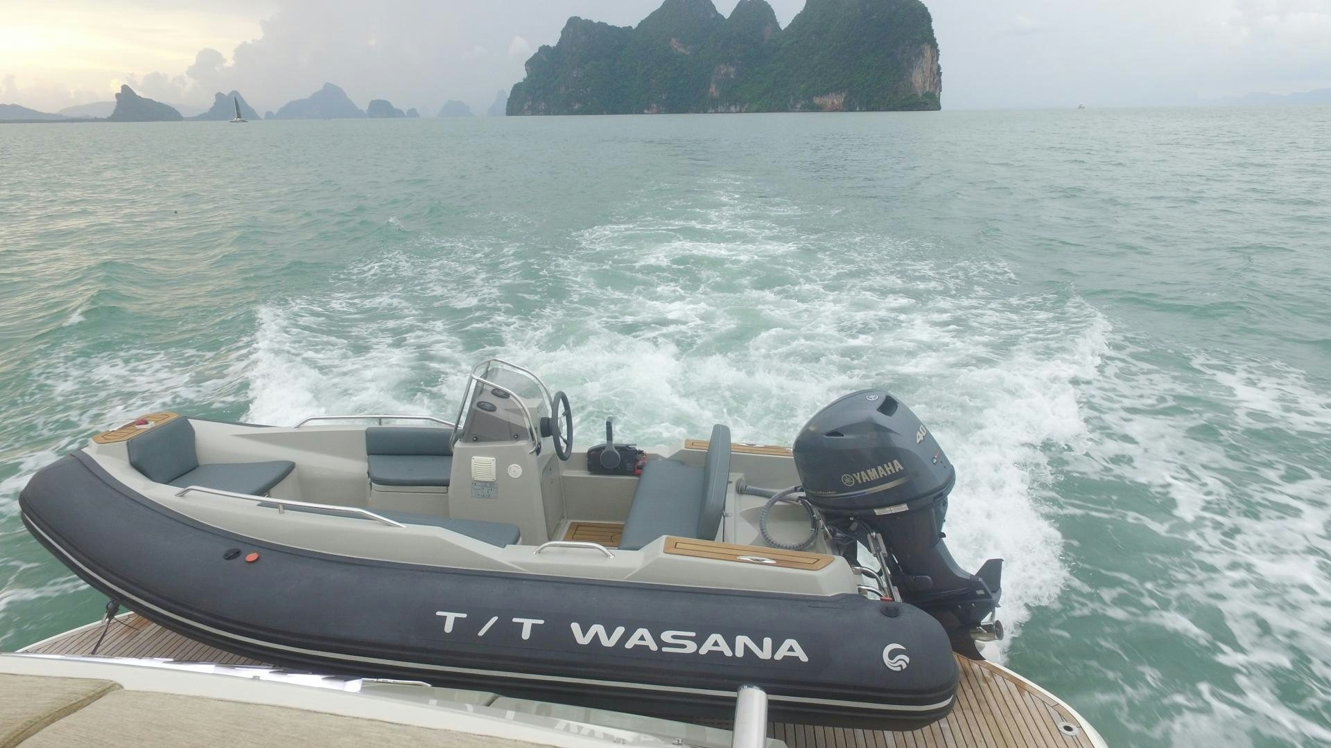a speed boat on the water aboard WASANA Yacht for Sale