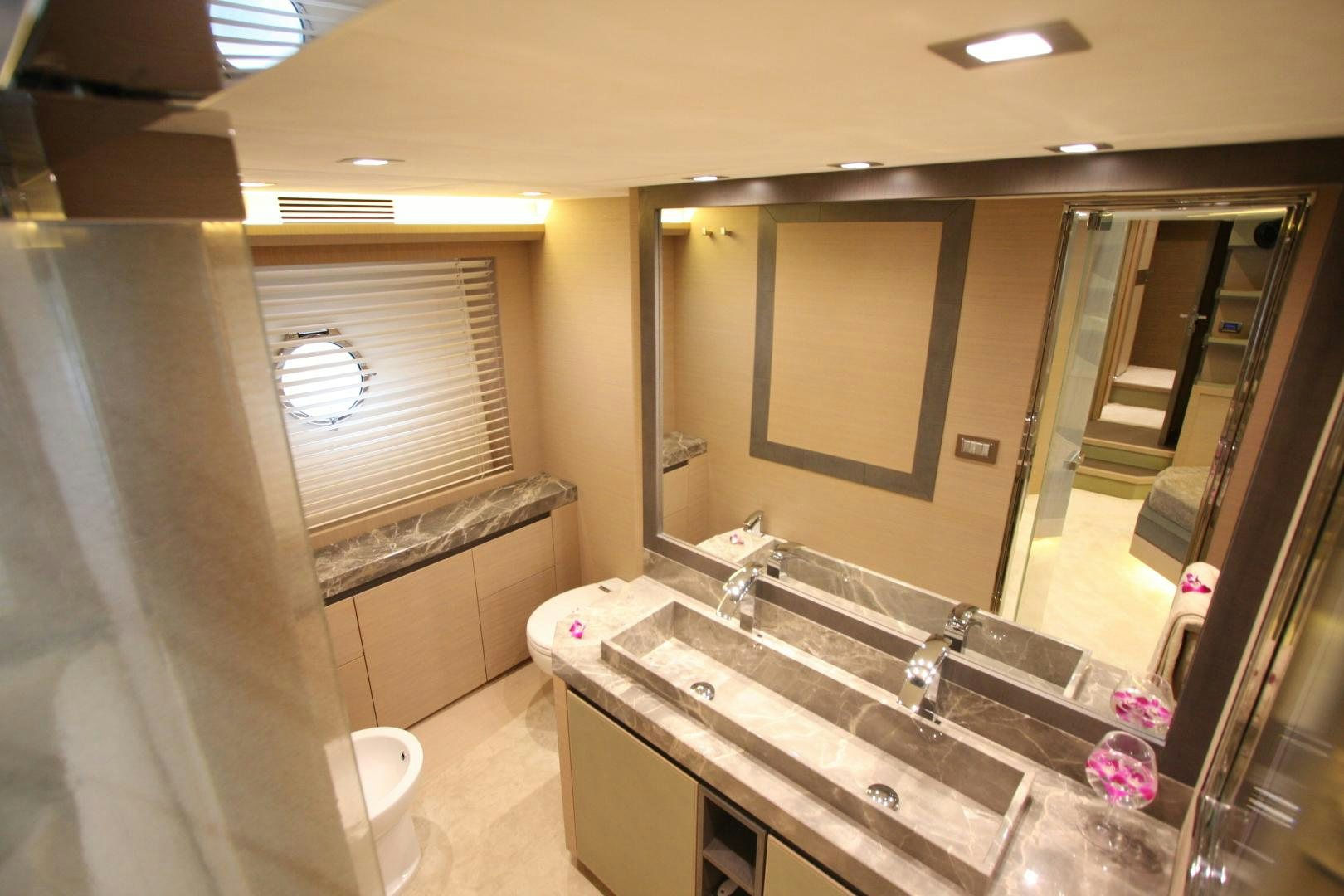 a bathroom with a large mirror aboard WASANA Yacht for Sale