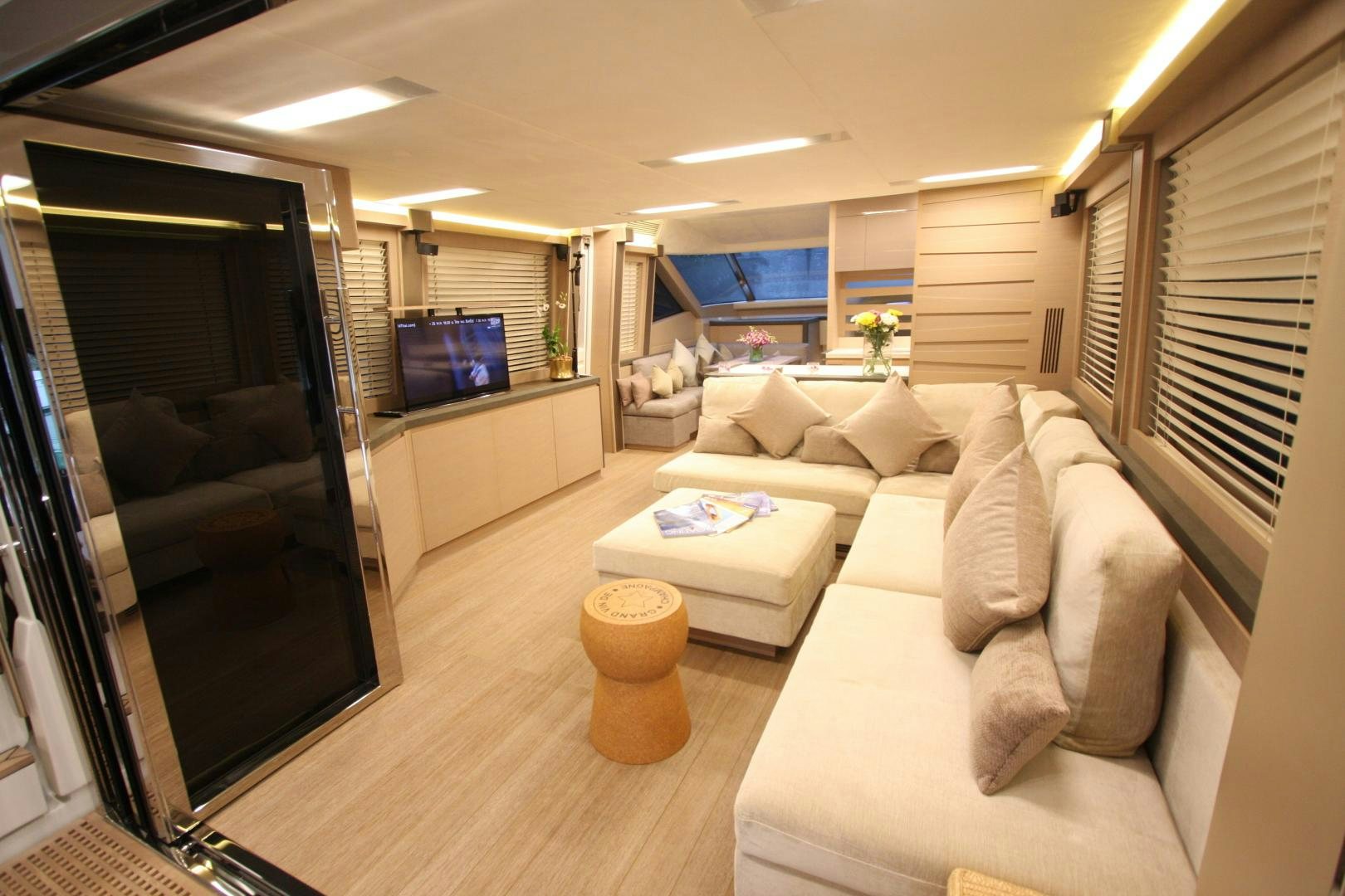 a living room with a large window aboard WASANA Yacht for Sale