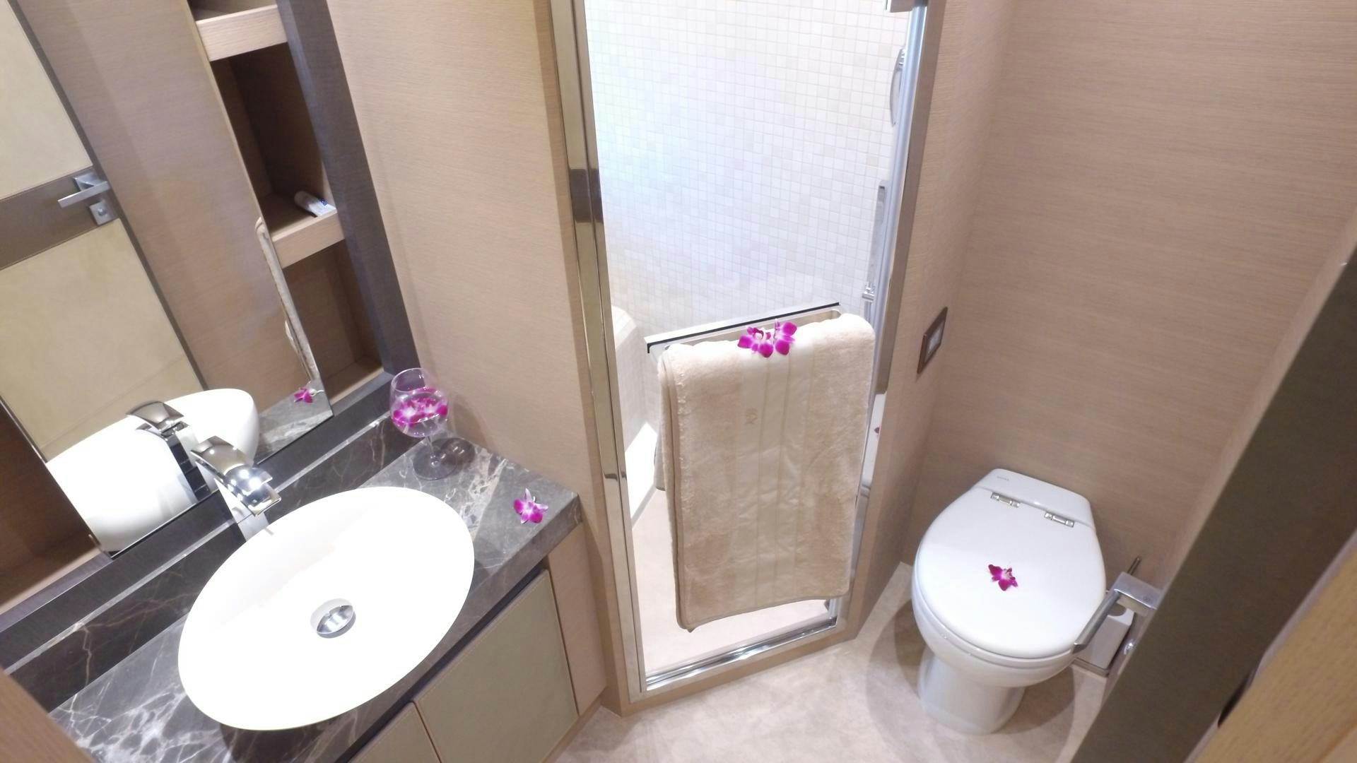 a bathroom with a sink and a toilet aboard WASANA Yacht for Sale
