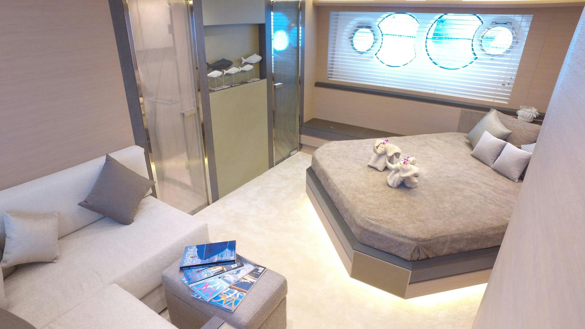 a room with a bed and a couch aboard WASANA Yacht for Sale