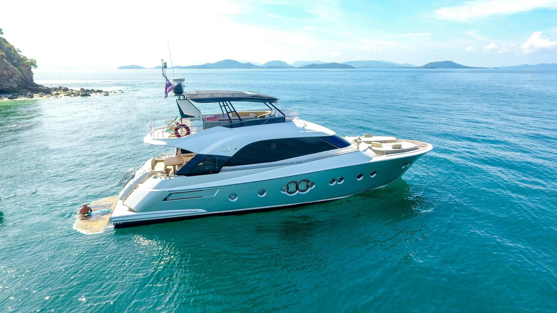 a white yacht in the water aboard WASANA Yacht for Sale