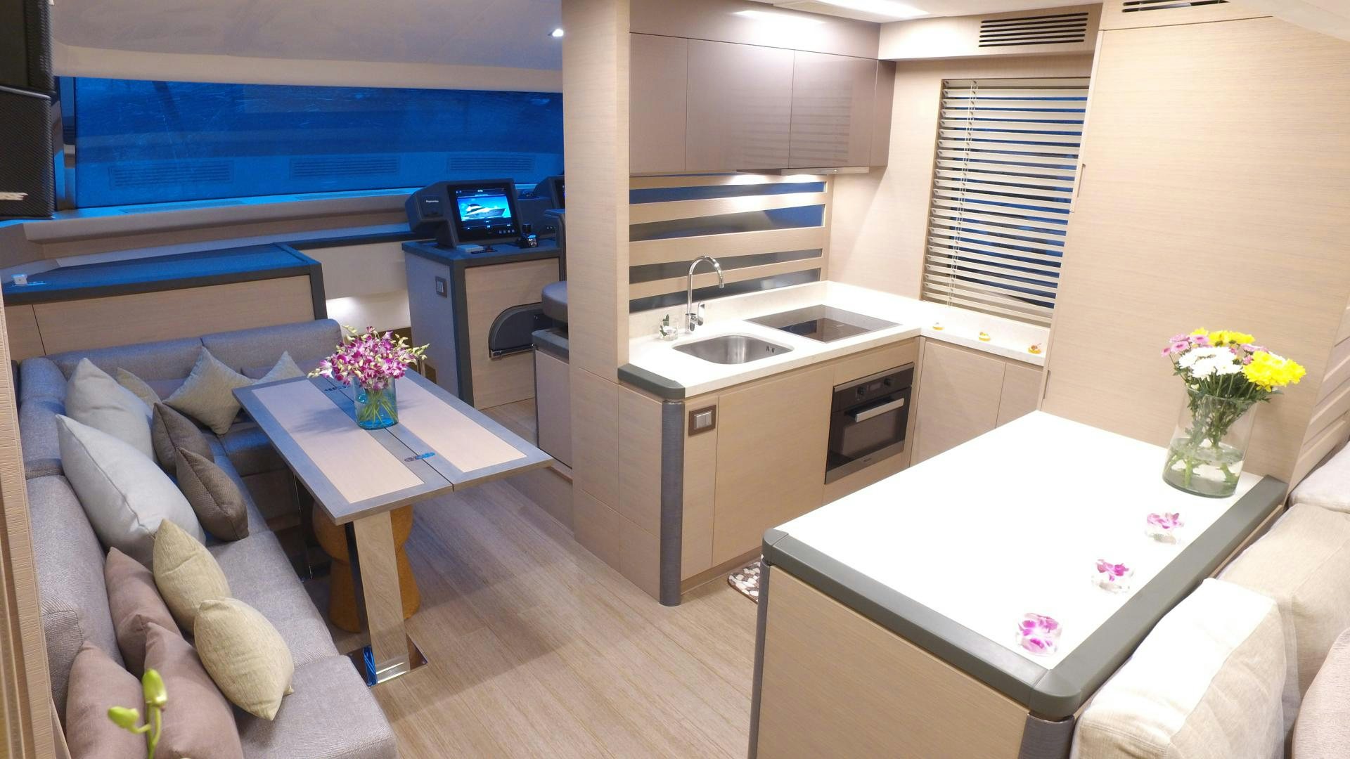 a living room with a couch and a table aboard WASANA Yacht for Sale