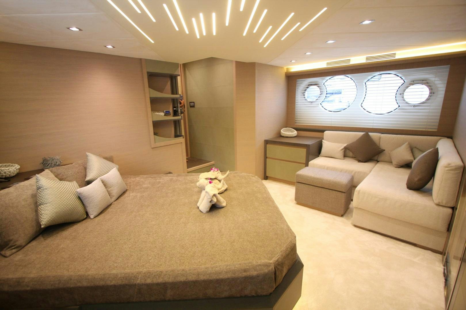 a living room with a couch and a tv aboard WASANA Yacht for Sale