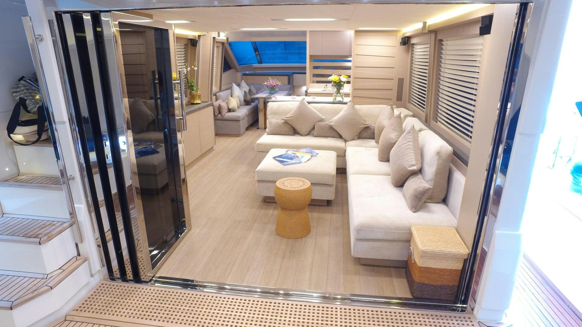 a living room with a large mirror aboard WASANA Yacht for Sale