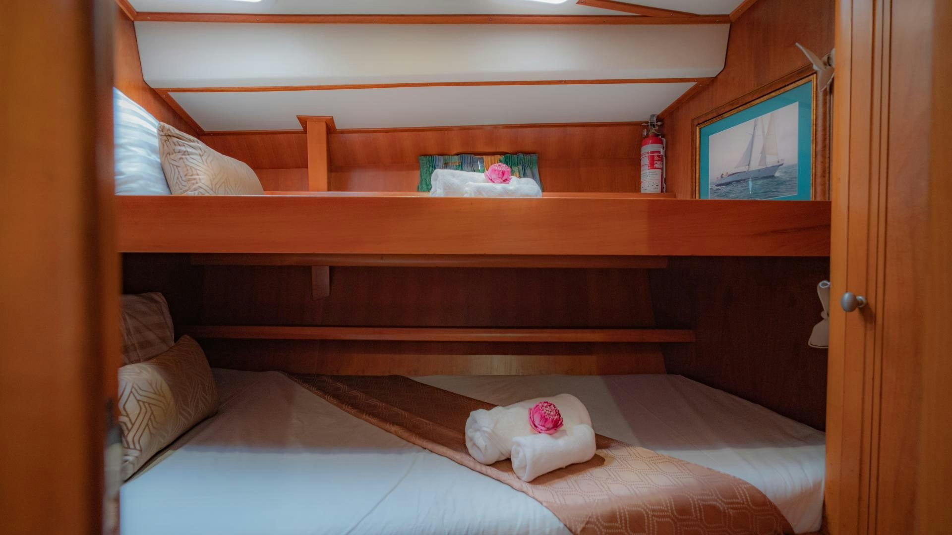 a bed with a wooden headboard aboard MI LIAN  Yacht for Sale