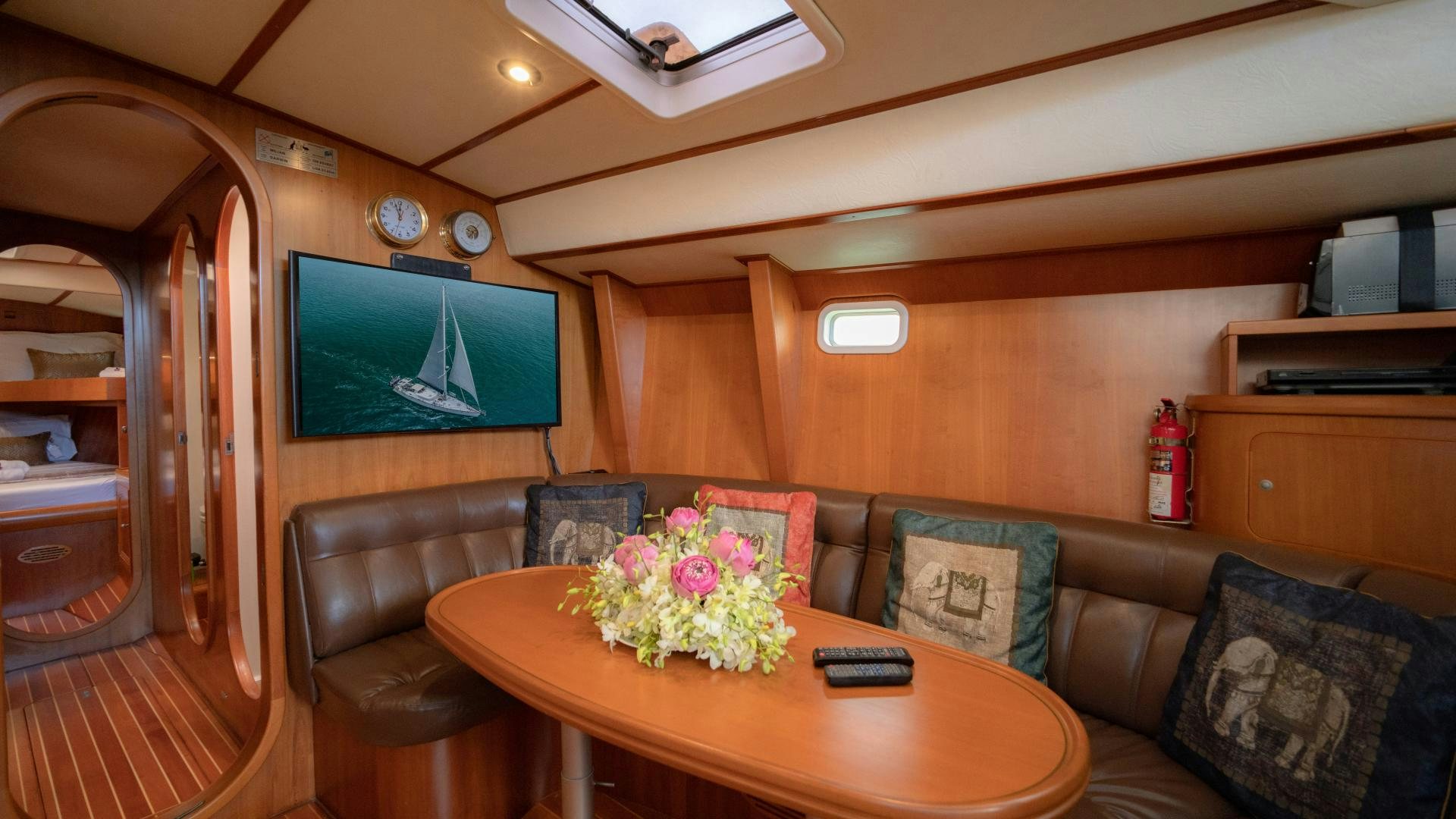 a living room with a couch and a television aboard MI LIAN  Yacht for Sale