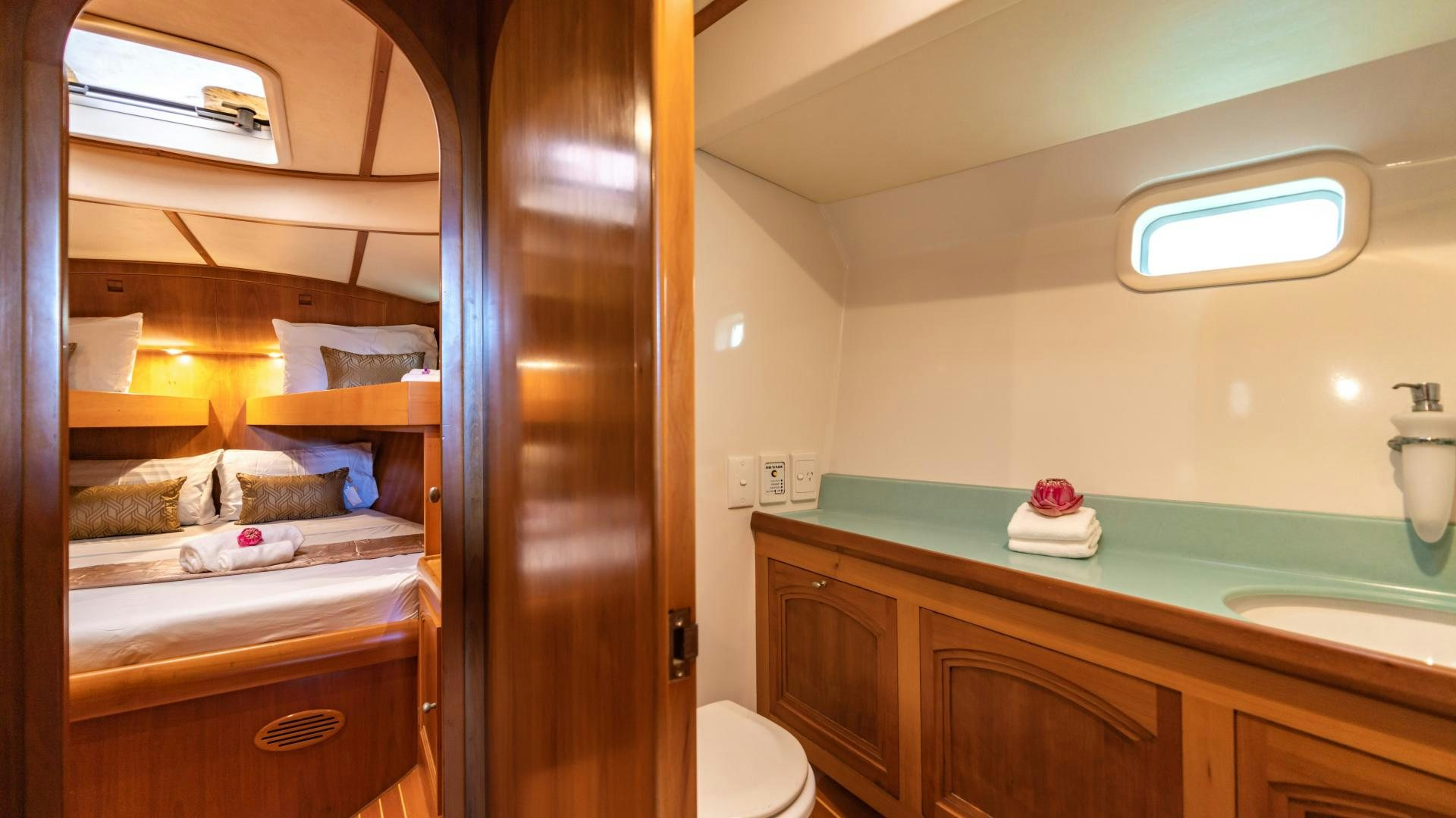 a bathroom with a sink and a bed aboard MI LIAN  Yacht for Sale