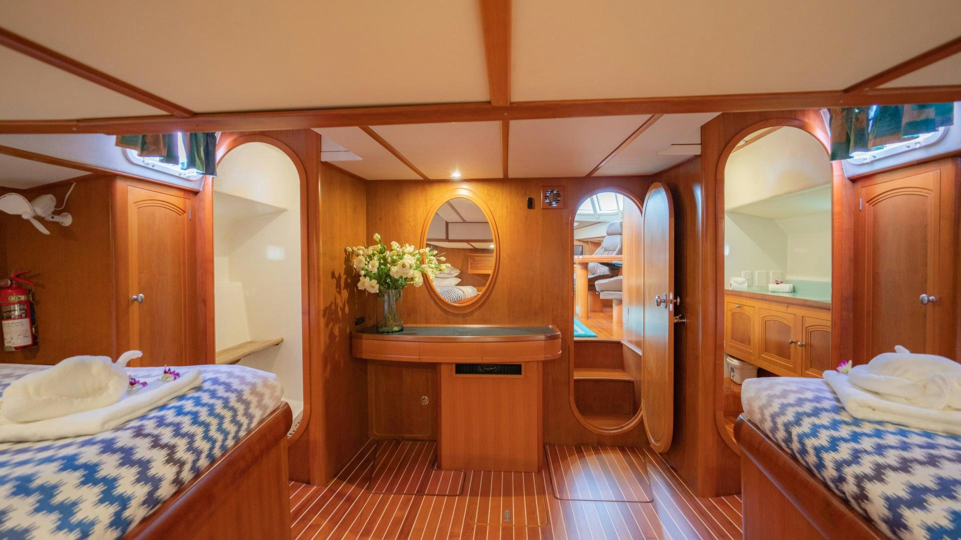 a room with a bed and a mirror aboard MI LIAN  Yacht for Sale