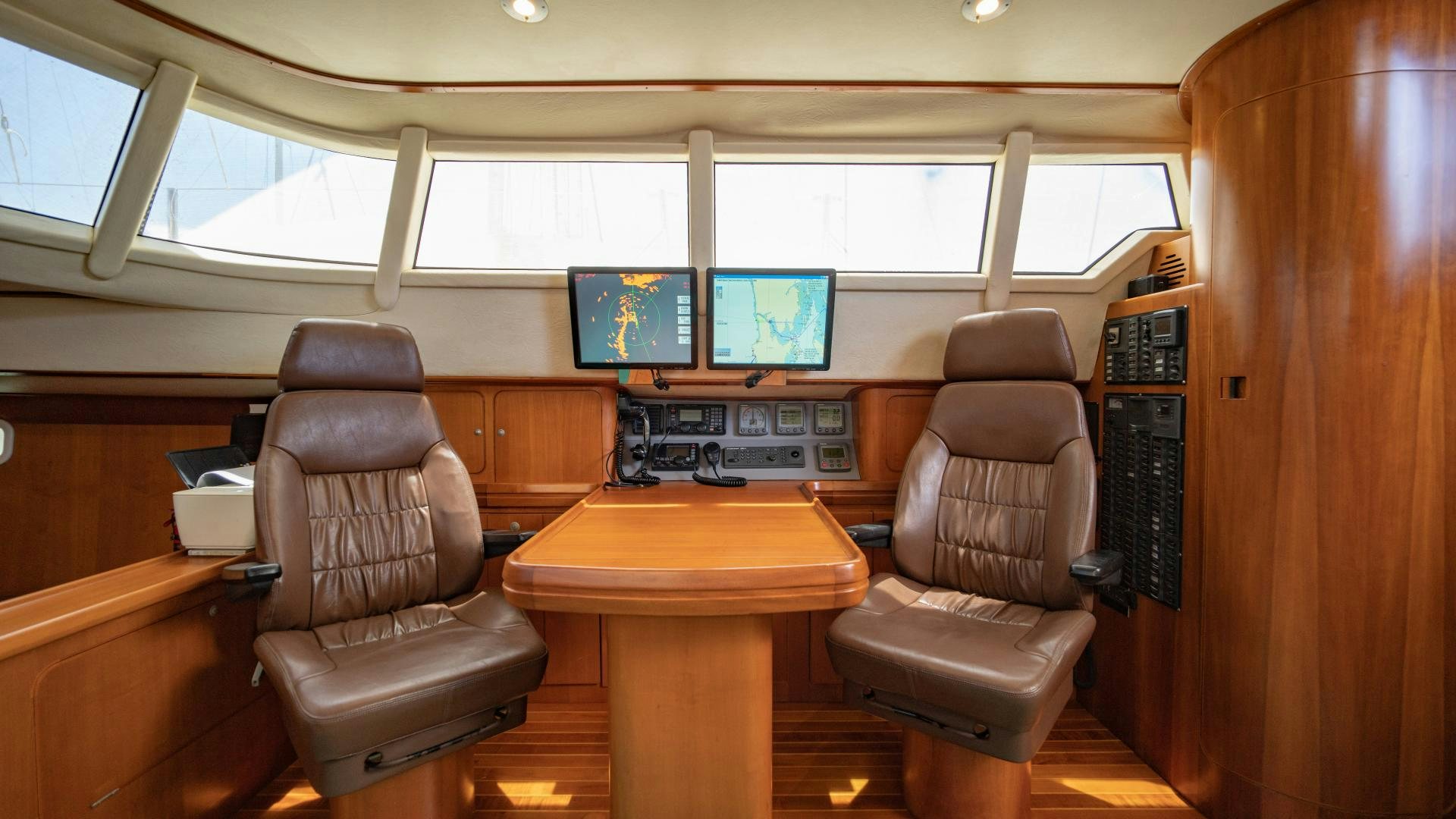 a room with chairs and a table aboard MI LIAN  Yacht for Sale