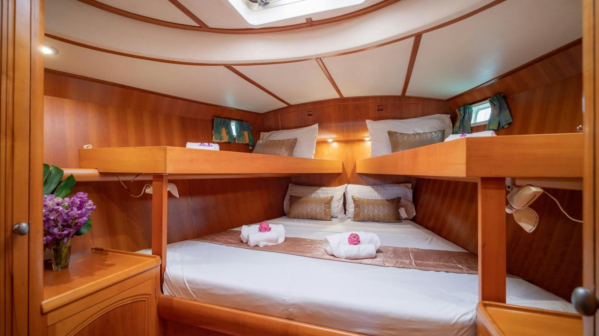 a bed with a pink pillow aboard MI LIAN  Yacht for Sale