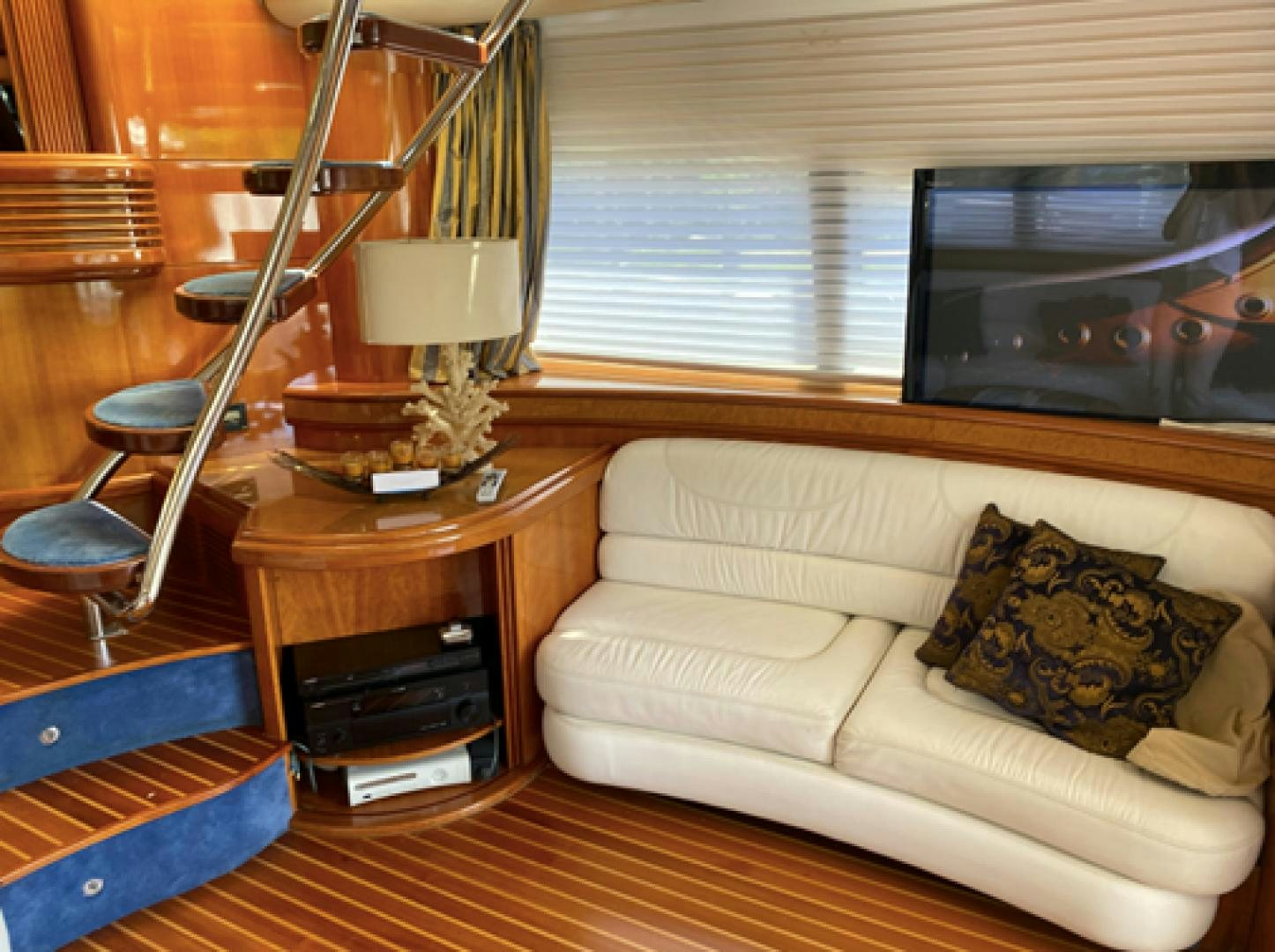 a living room with a couch and a tv aboard EUROPA Yacht for Sale