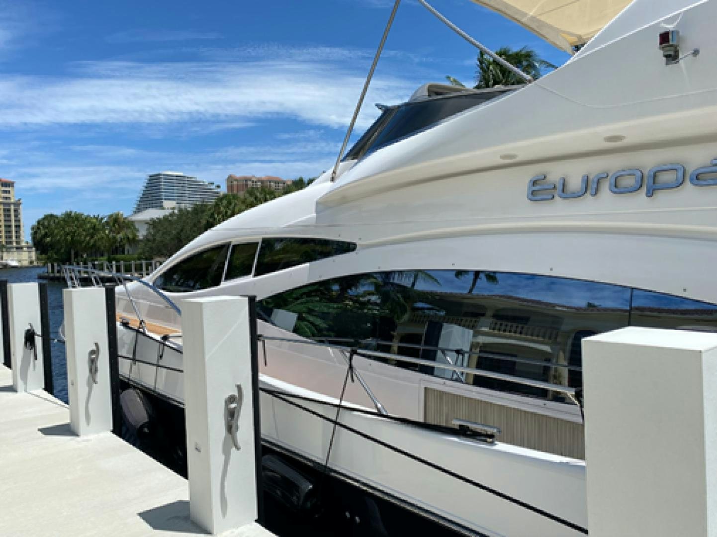 a white yacht in a dock aboard EUROPA Yacht for Sale