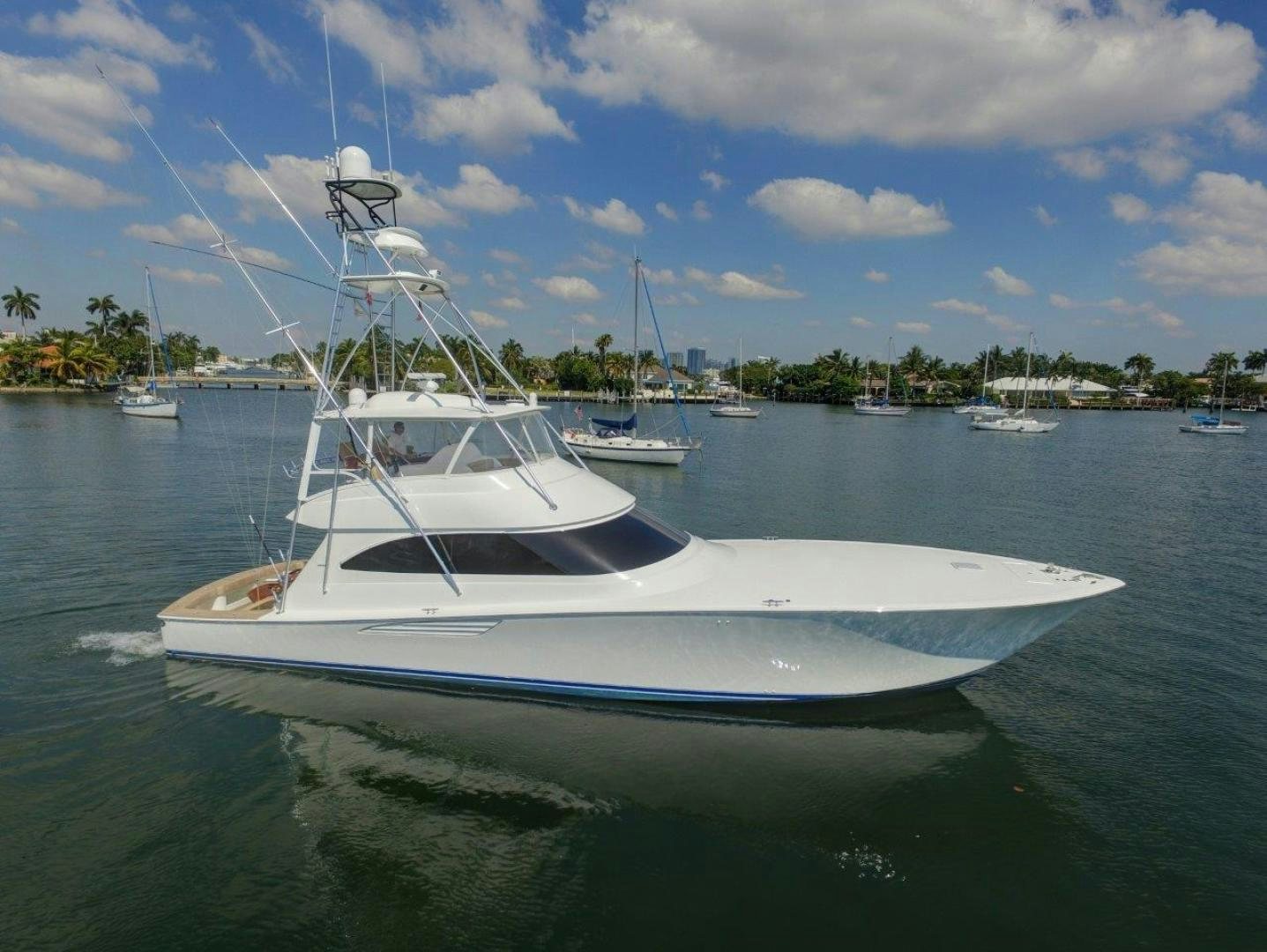 a white boat in the water aboard KICK'N IT Yacht for Sale